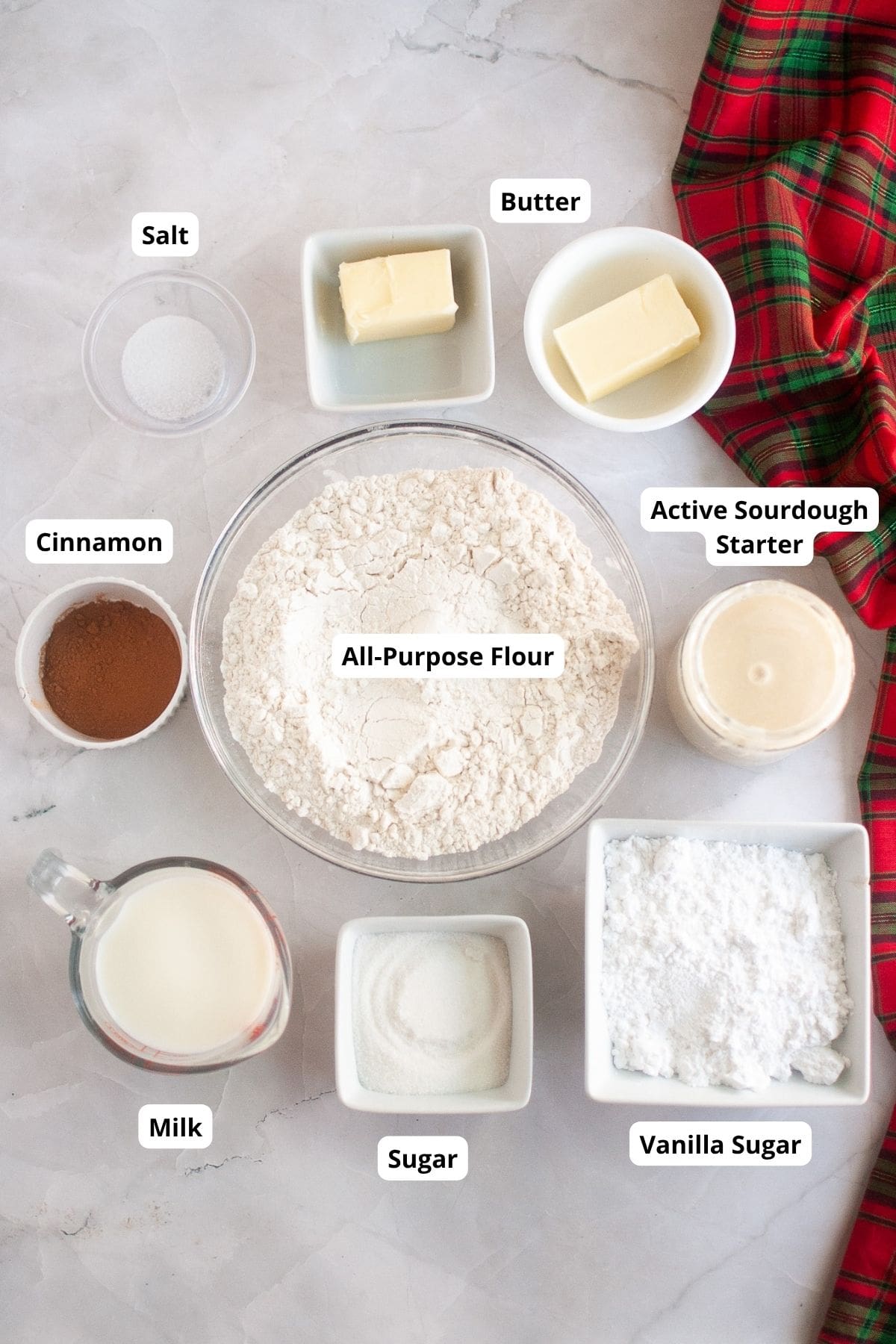 Baking ingredients being arranged on a flat surface, ready for preparation.