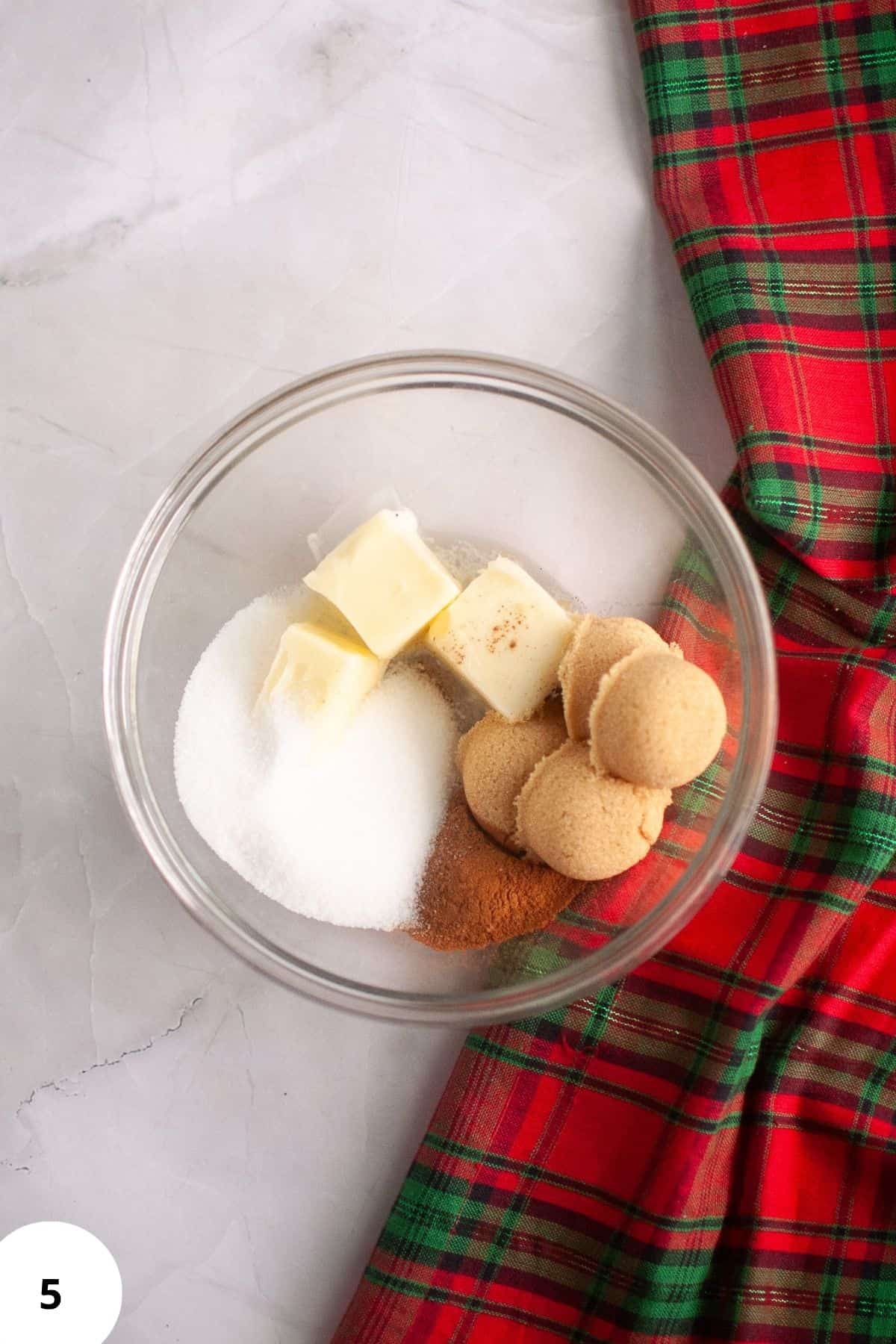 Baking ingredients being mixed together in a large bowl during dough preparation.