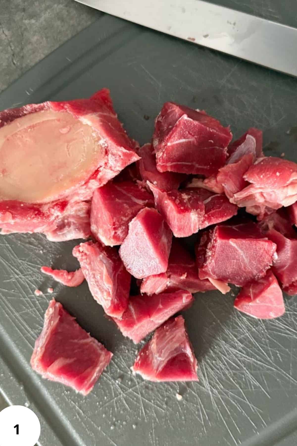Juicy beef cubes sliced for stew, roast, or grilling, displayed on a kitchen surface.