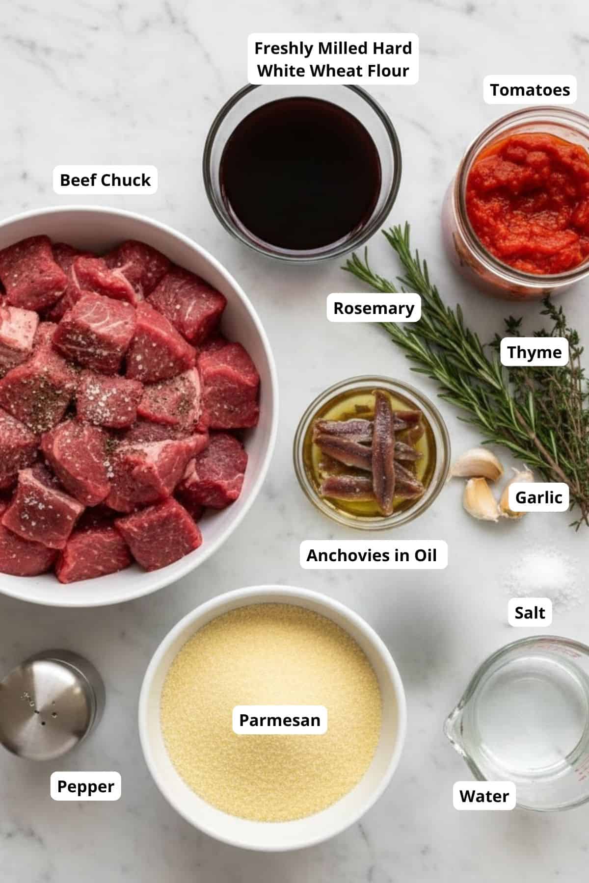 Beef cubes, flour, tomato paste, herbs, and seasonings for bread or pastry recipes.