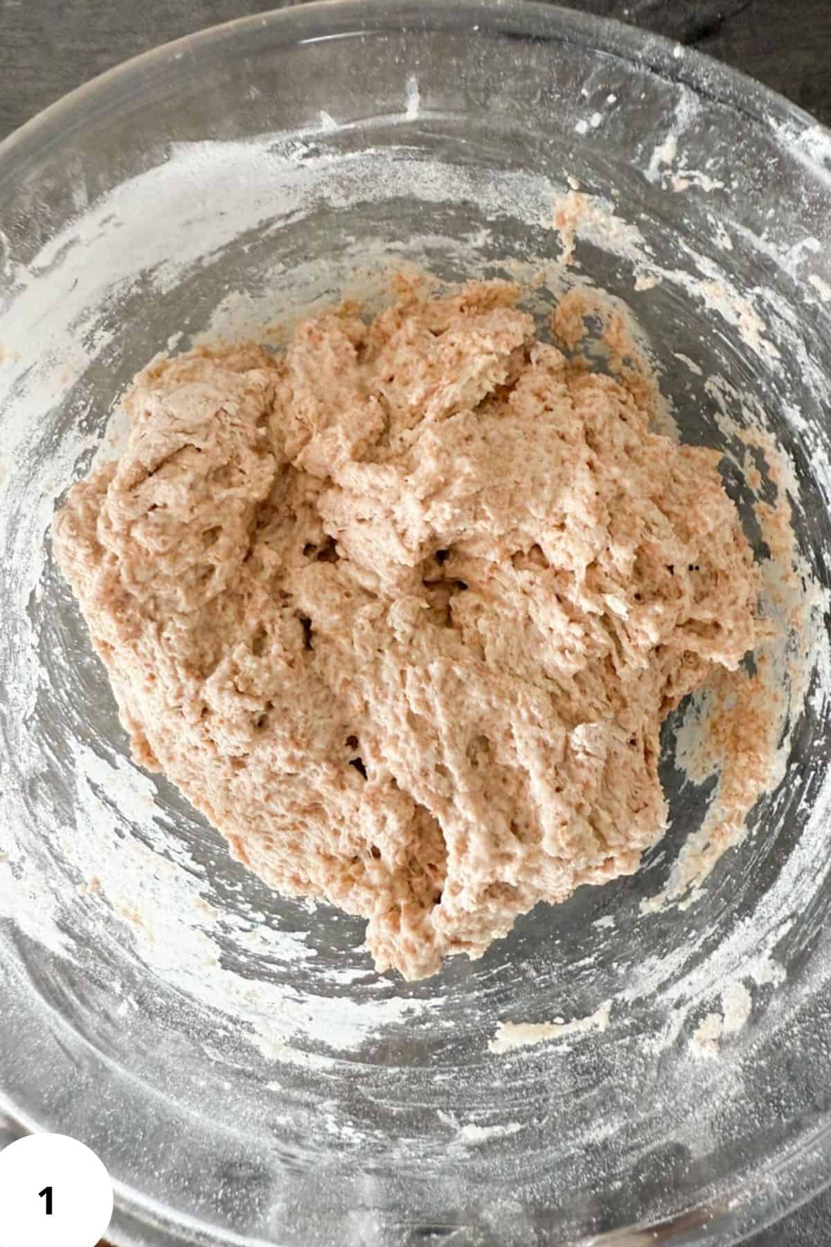 Dough resting in a large bowl during the fermentation stage.