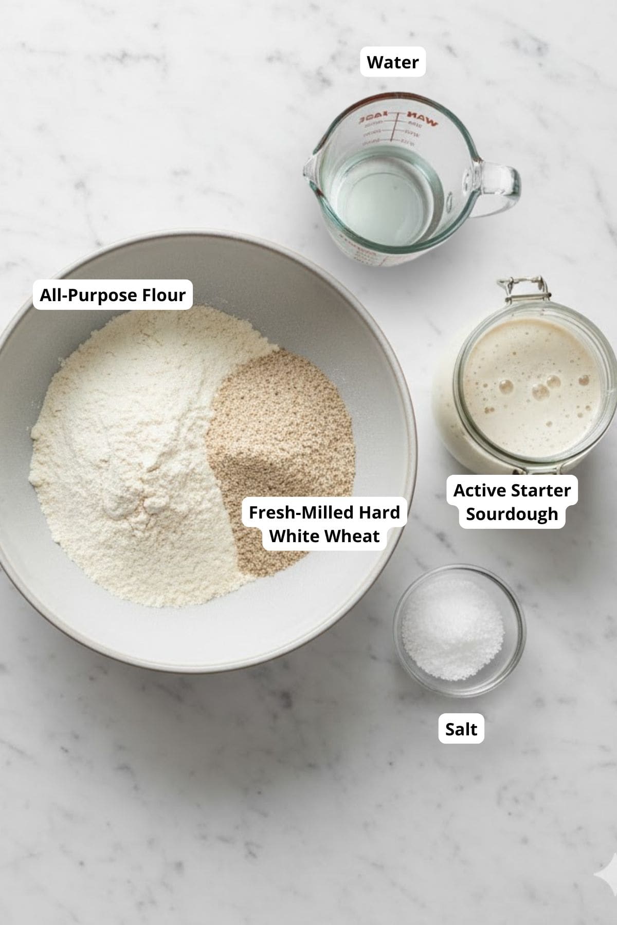 Baking ingredients arranged on a surface, ready to be mixed for making sourdough rolls.