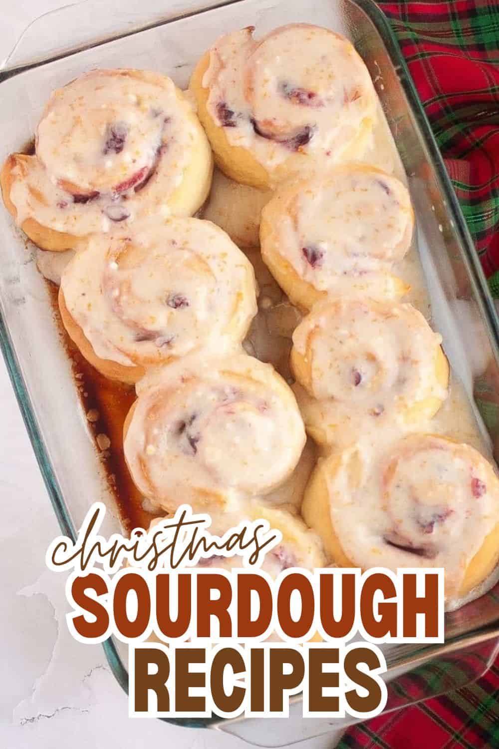 Freshly baked sourdough buns with berries and icing for Christmas.