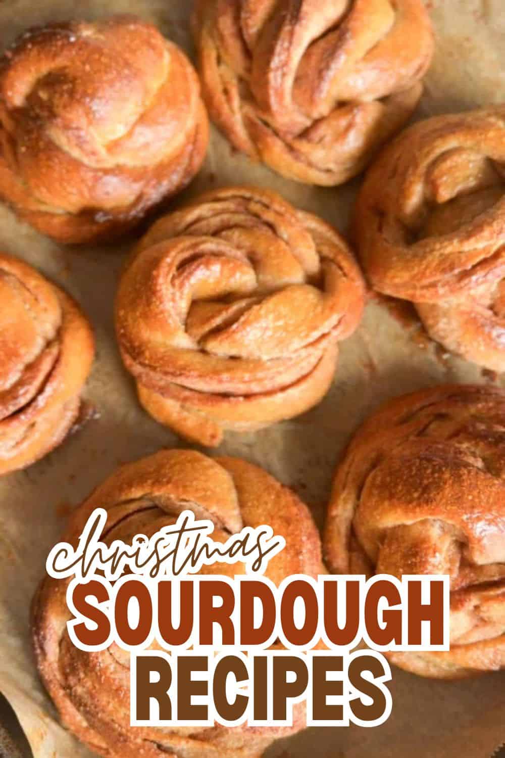 Close-up of freshly baked Christmas sourdough pastries on baking sheet.