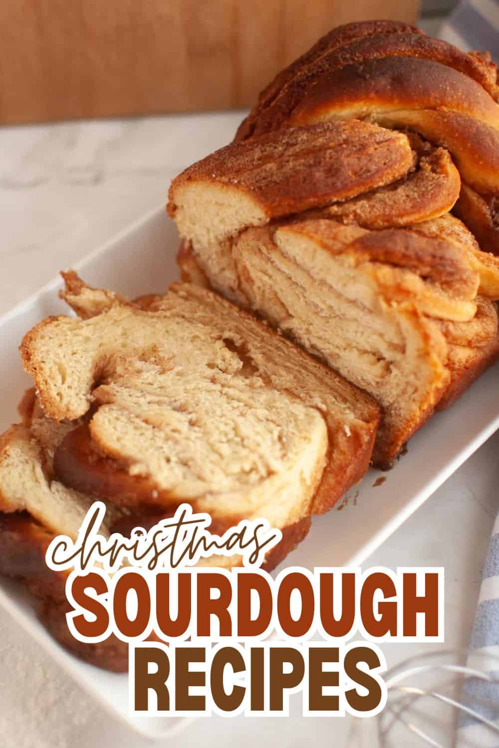 Homemade Christmas sourdough bread sliced on a white platter.