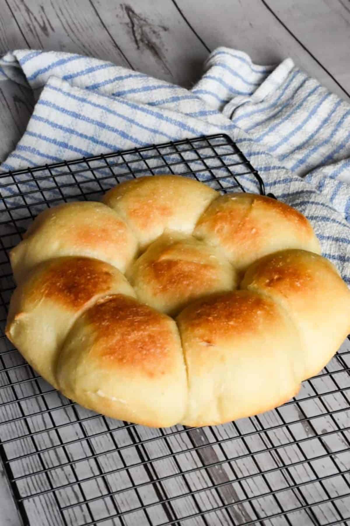 Freshly baked bread rolls with a golden crust, perfect for breakfast or sandwiches.