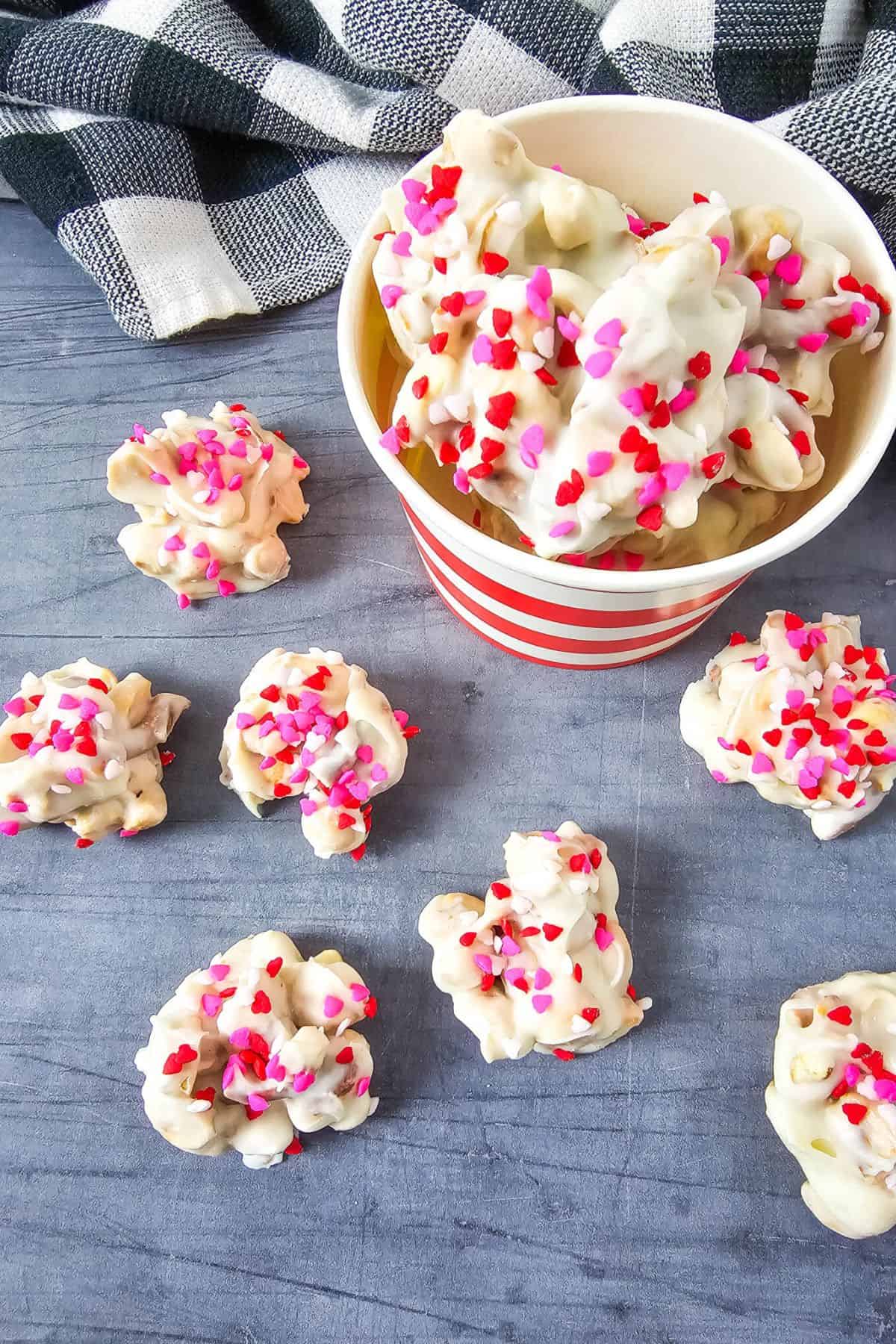 Valentine’s Day white chocolate cookies with colorful sprinkles, perfect for celebrations.