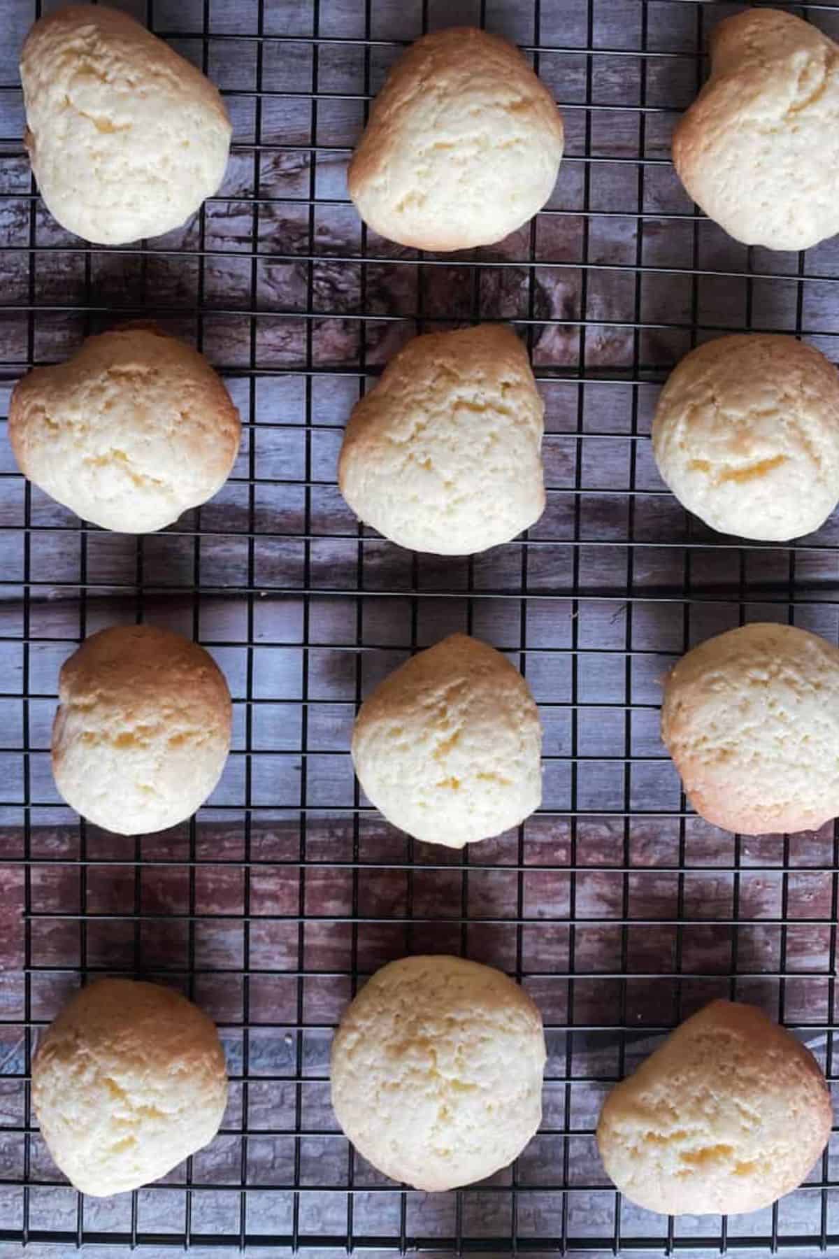 Sourdough vanilla wafers neatly lined on a wire cooling rack.