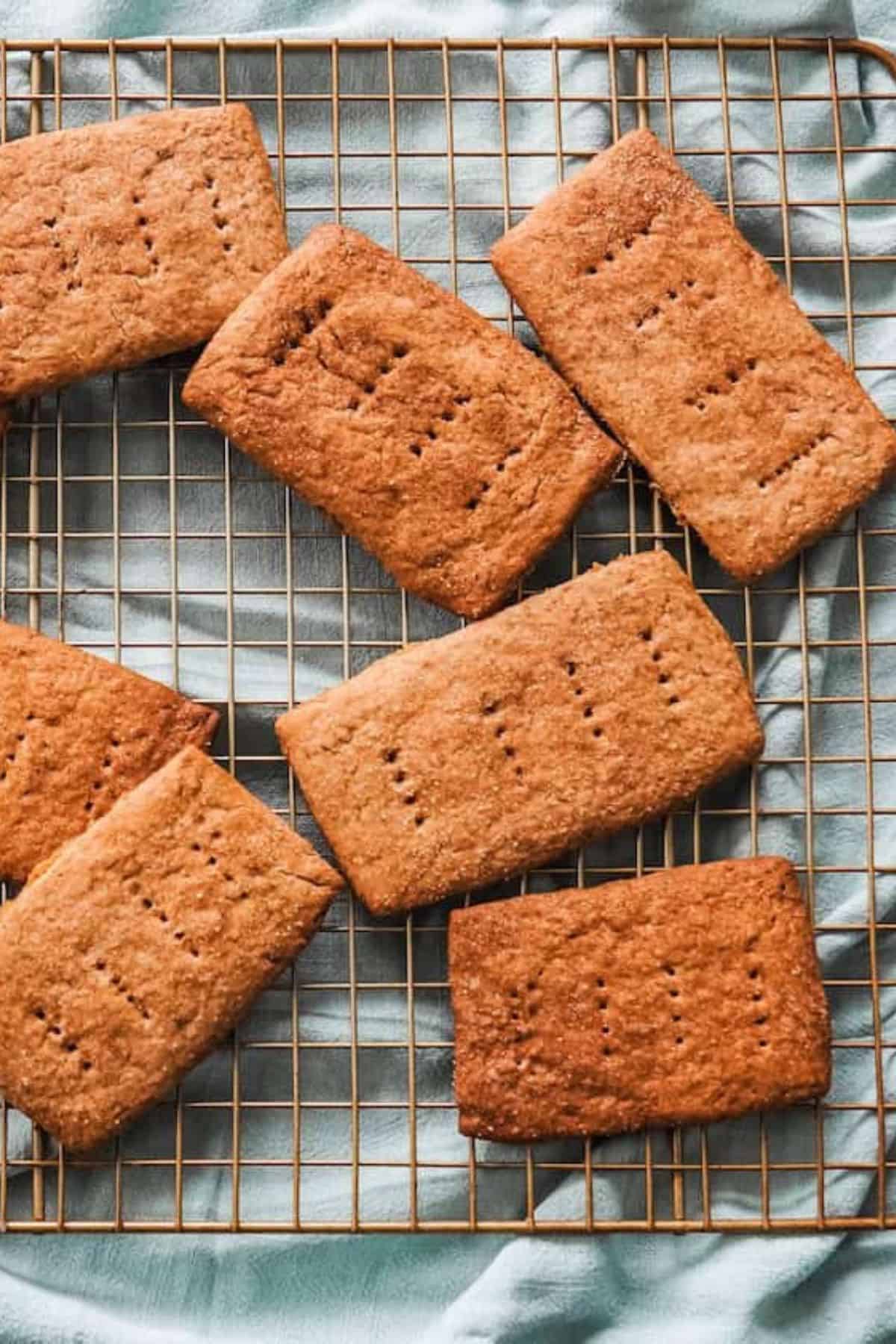 Sourdough discard graham crackers resting on a wire cooling rack.