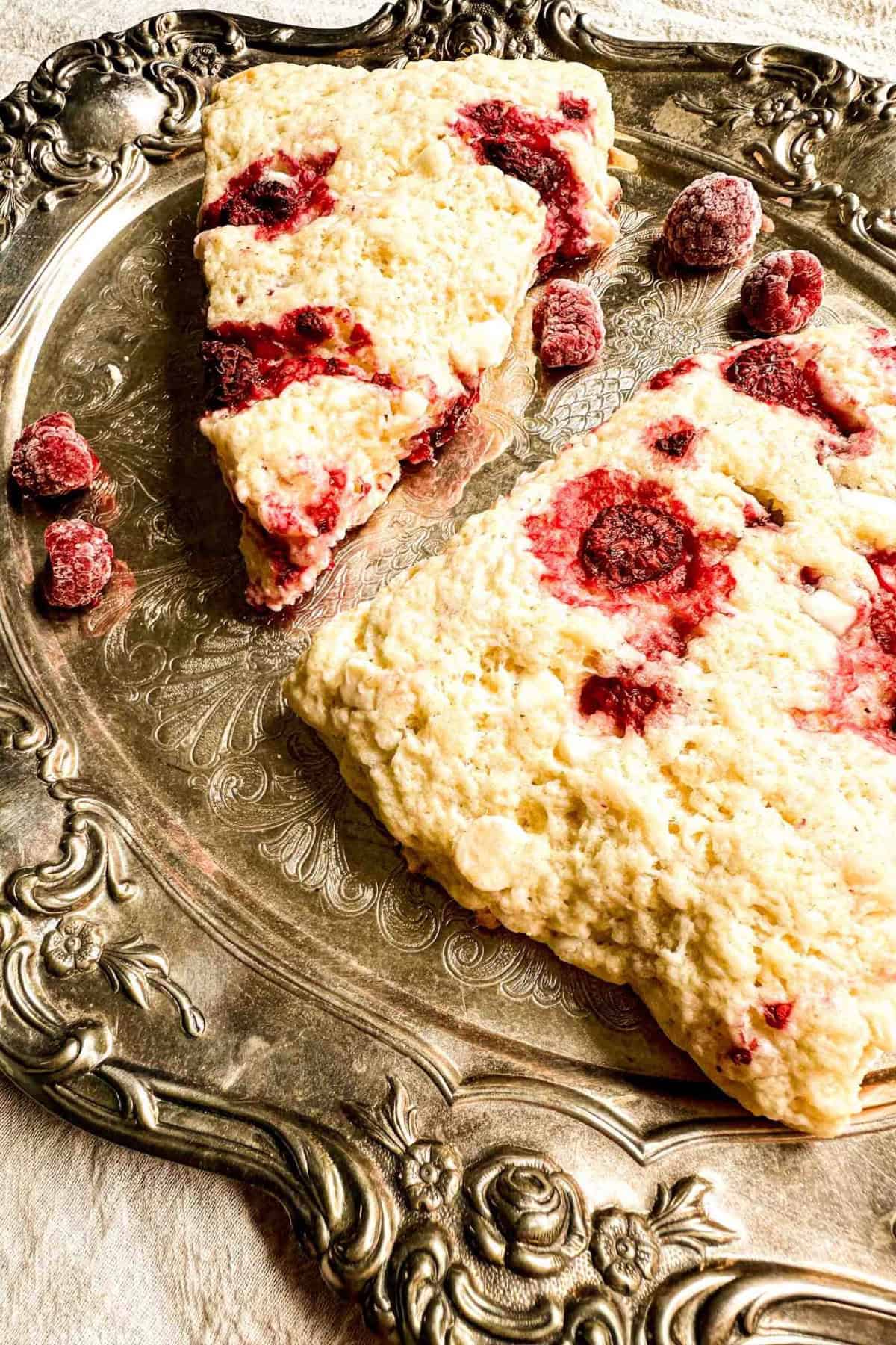 Close-up of sourdough scones showing raspberries inside.