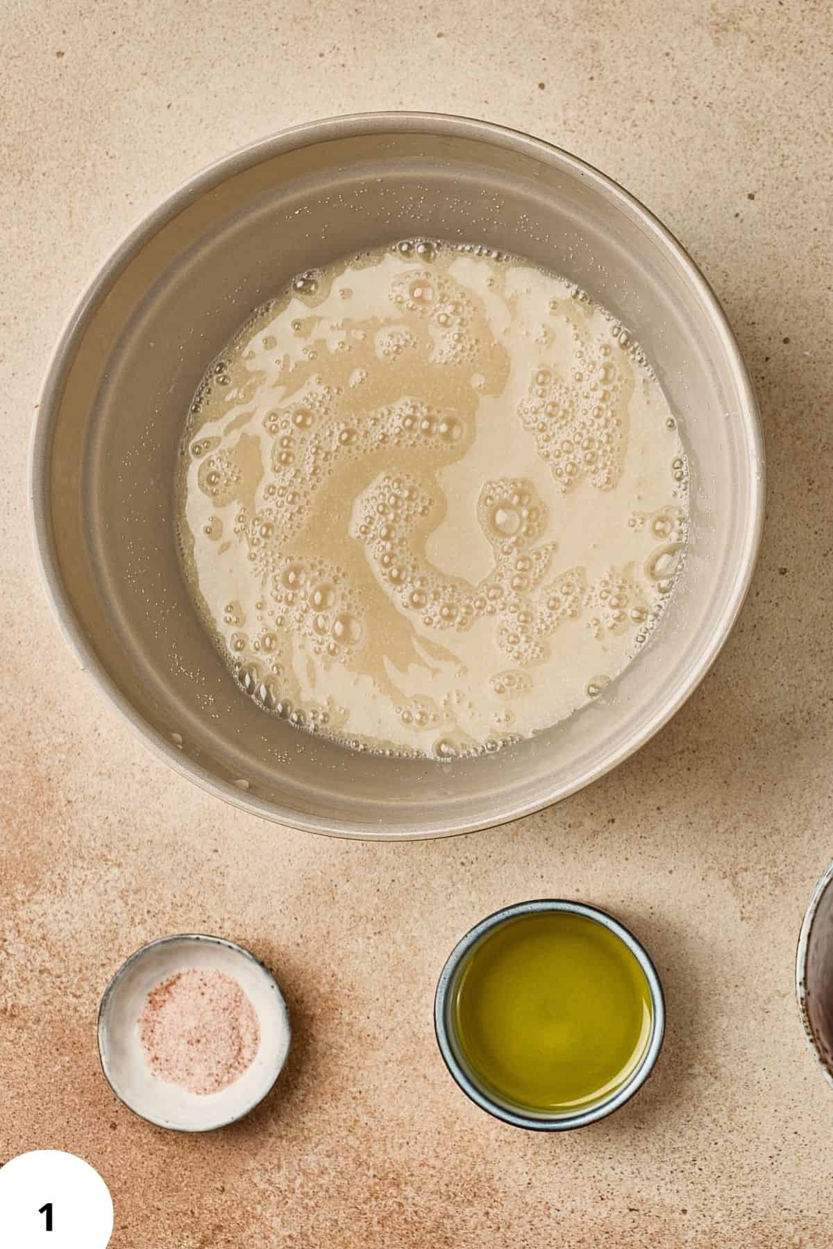A large bowl filled with mixture and surrounded with other ingredients.