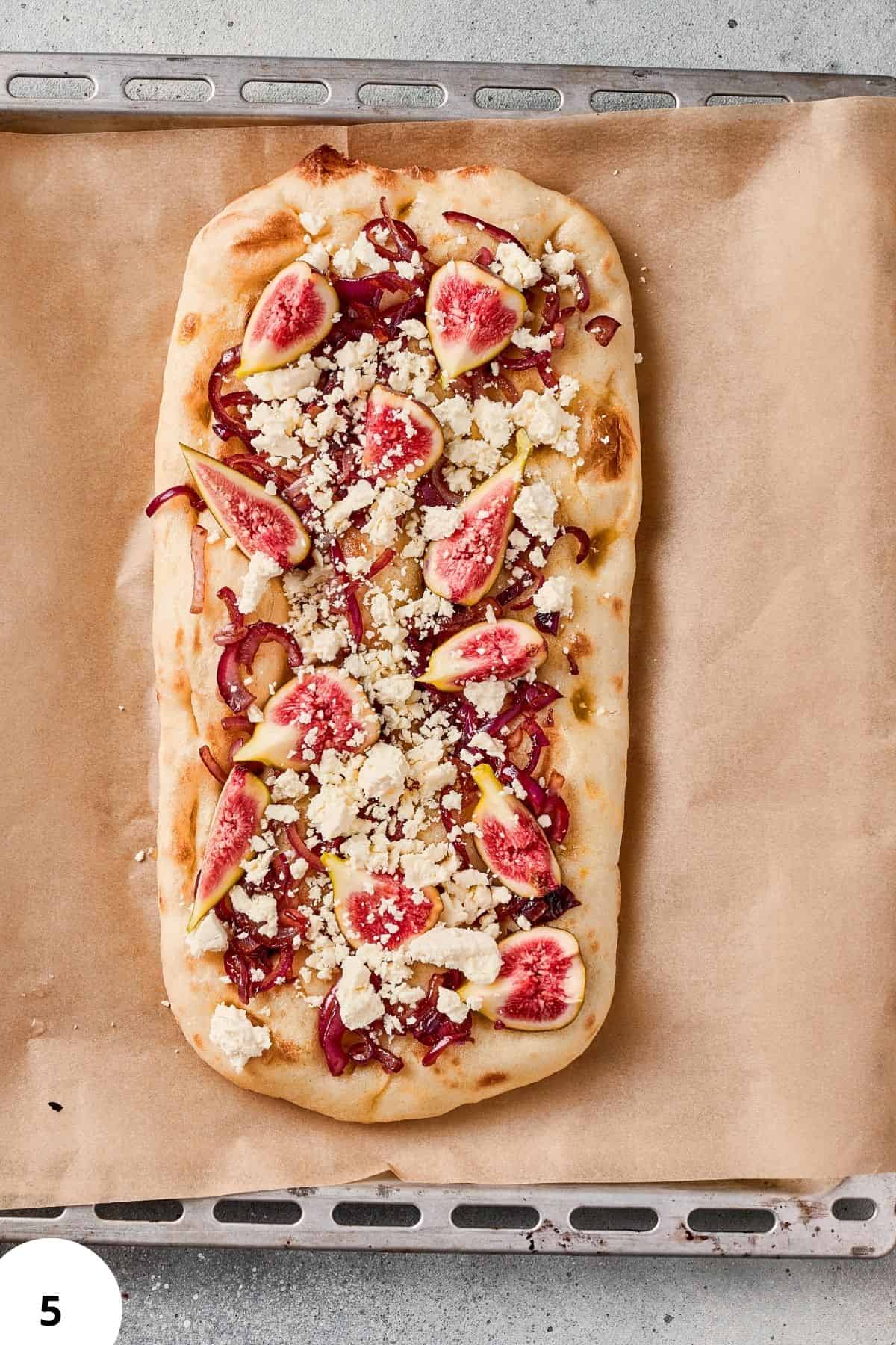 Delicious homemade focaccia with fresh figs, cheese, and toppings, perfect for bread lovers and artisan baking enthusiasts.