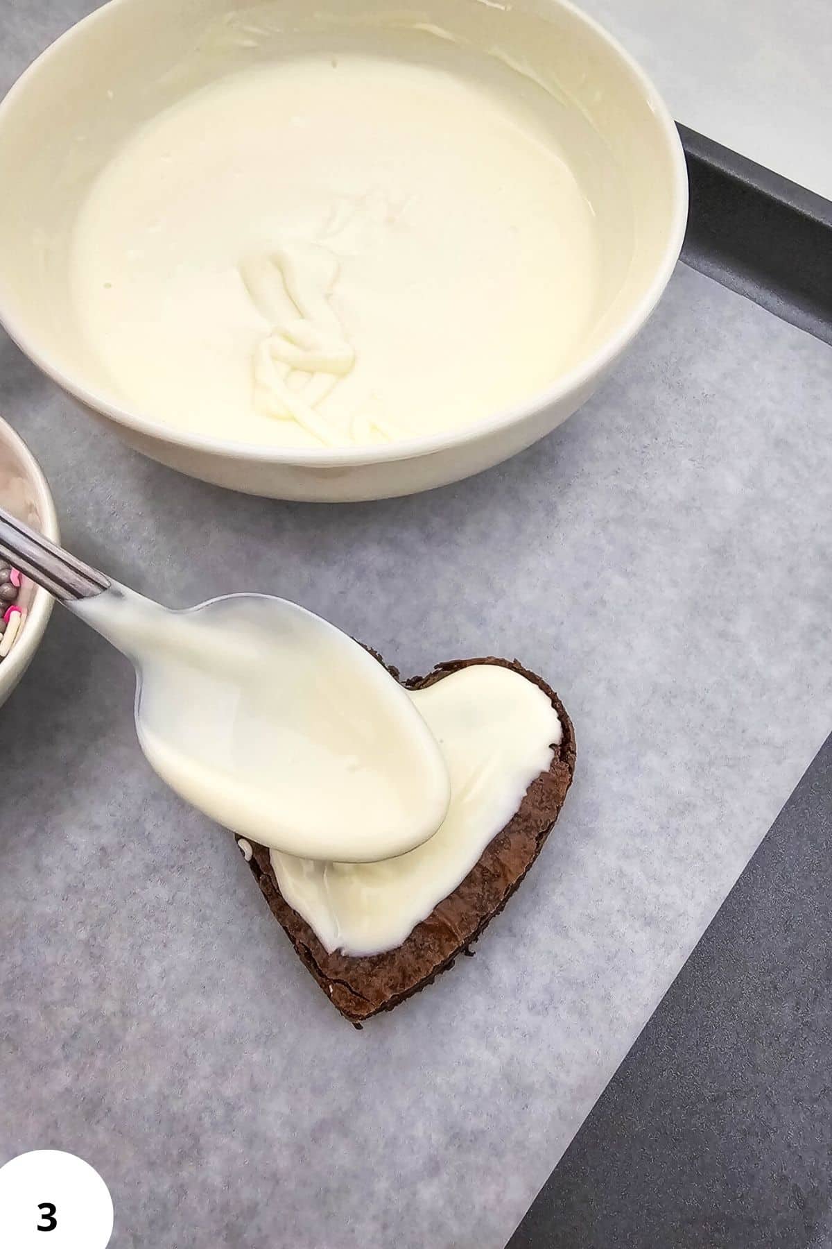 Delicious heart-shaped chocolate cake topped with smooth, homemade frosting, perfect for baking and decorating.