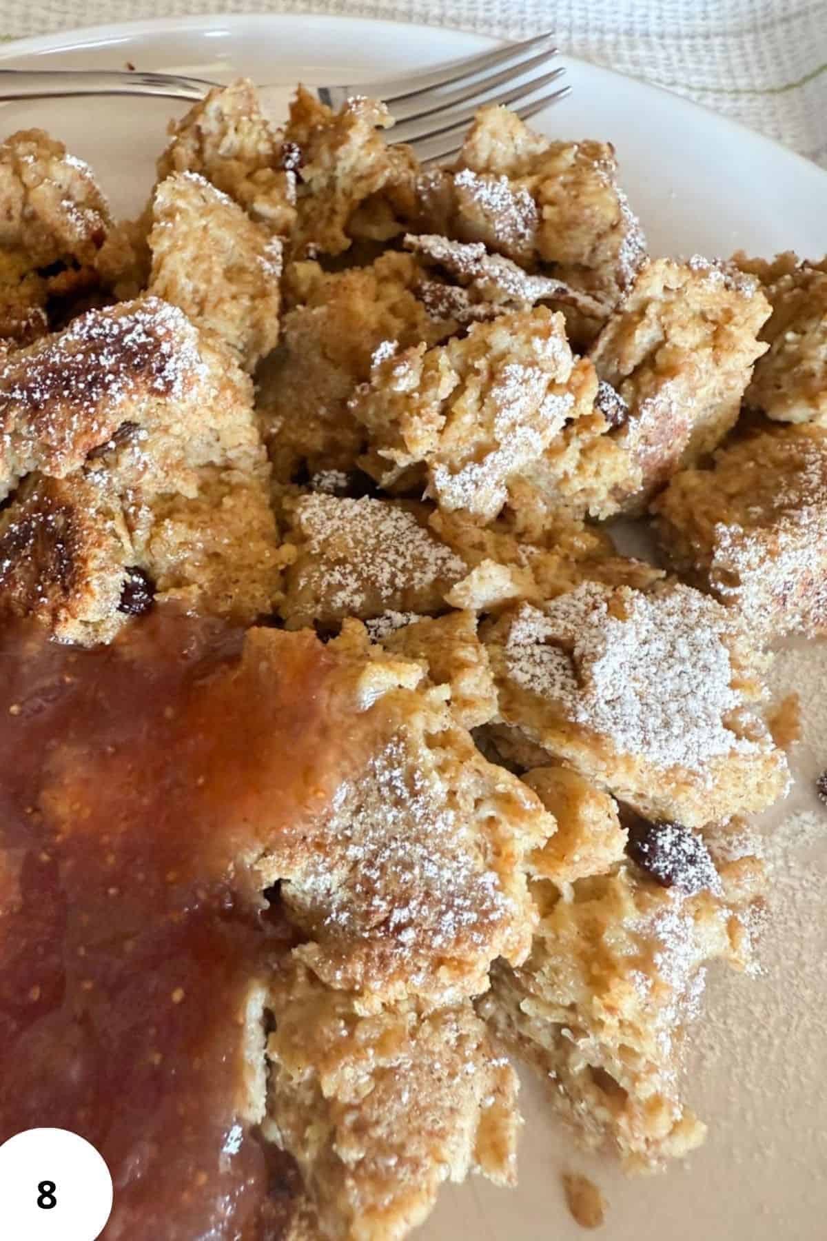 Close-up of shredded Austrian pancake with powdered sugar on top.