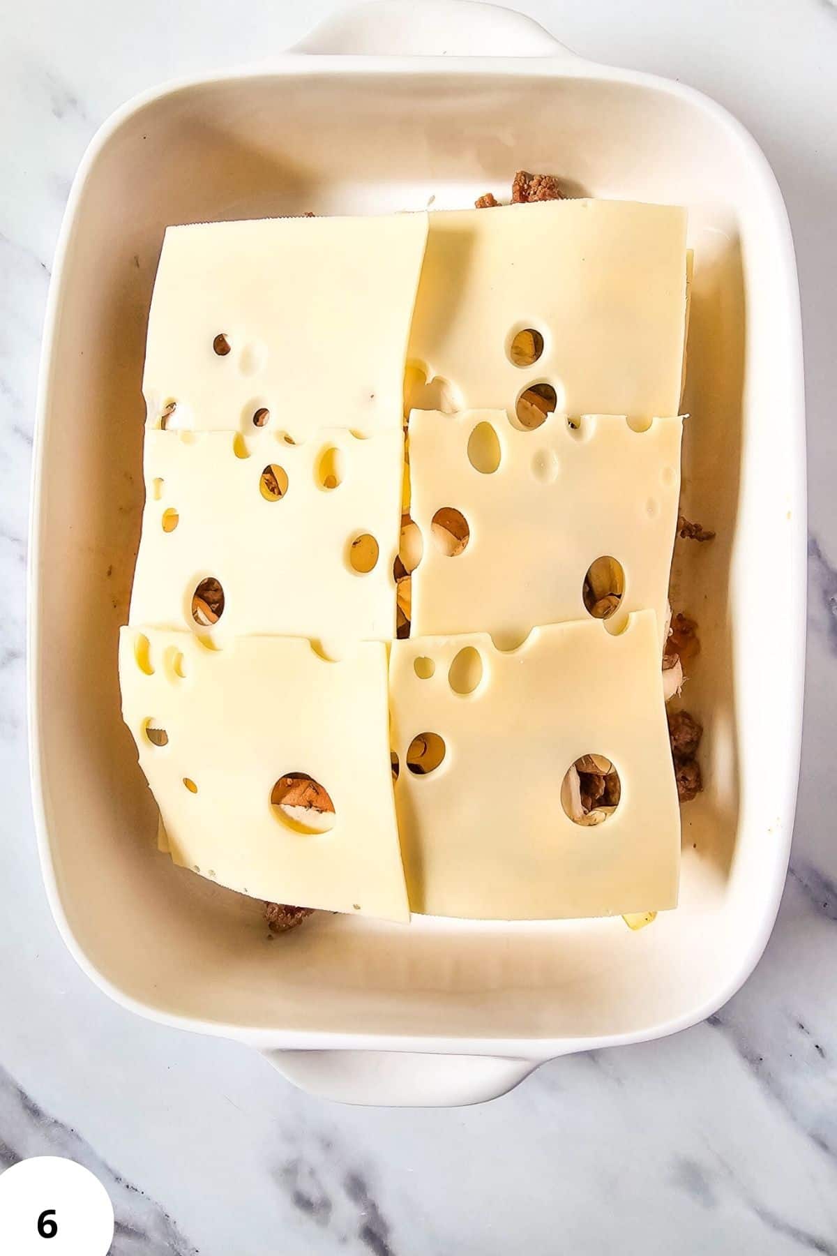 Cheese, meat loaf, Swiss cheese, baking, savory dish, homemade recipe.