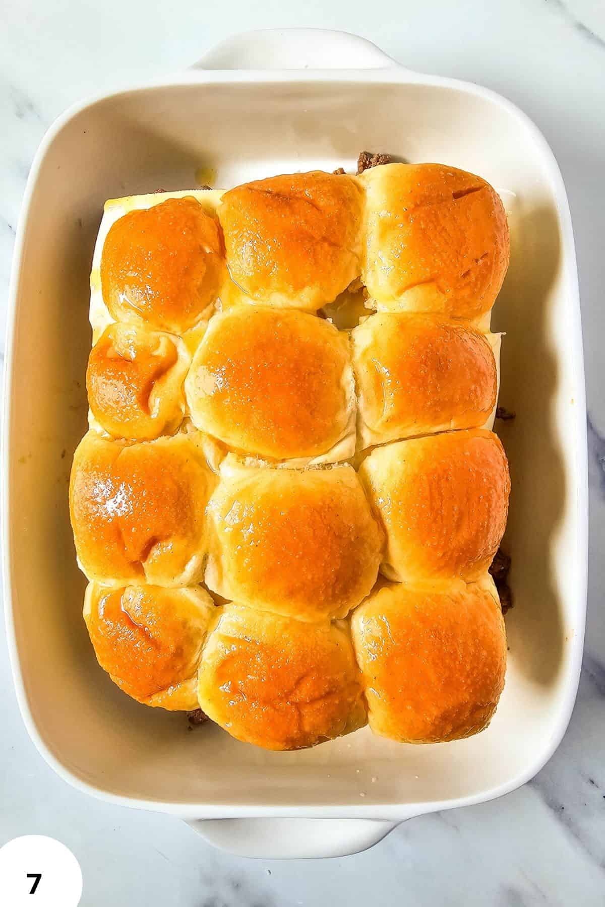 Delicious homemade bread rolls baked to golden perfection in a baking dish. Perfect for breakfast or dinner.