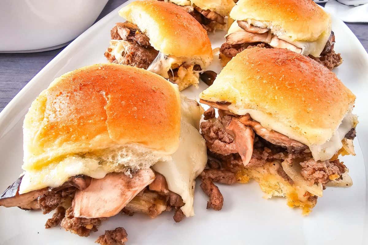 Delicious homemade bread rolls with roast beef, cheese, and soft bread for sandwiches. Great for baking enthusiasts.