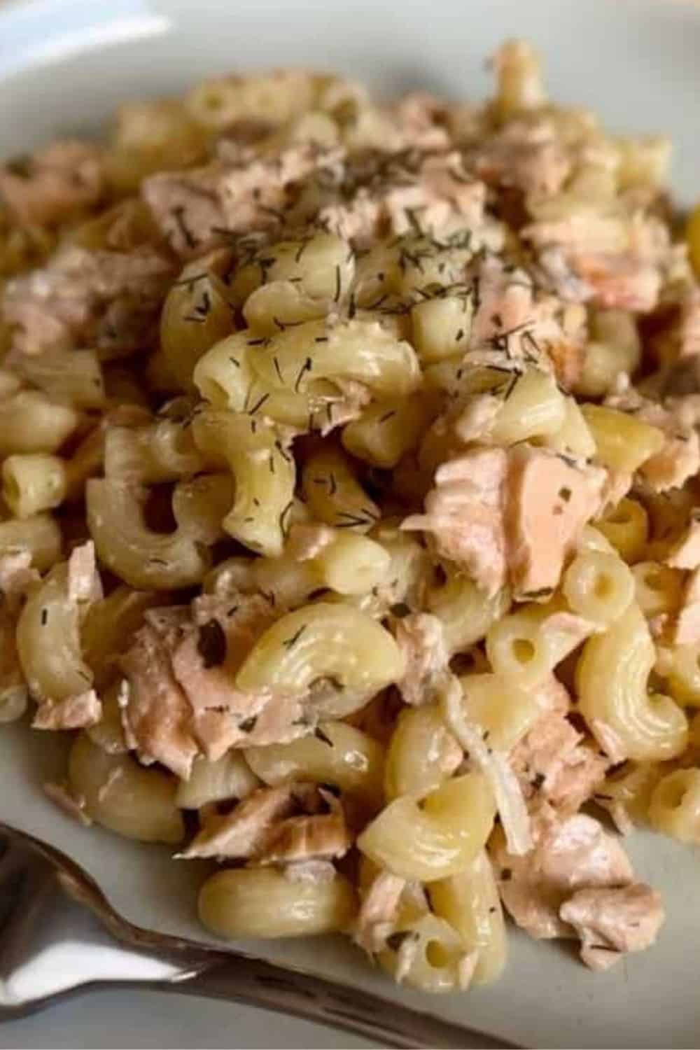 Fresh chicken pasta salad with herbs, celery, and a creamy dressing.