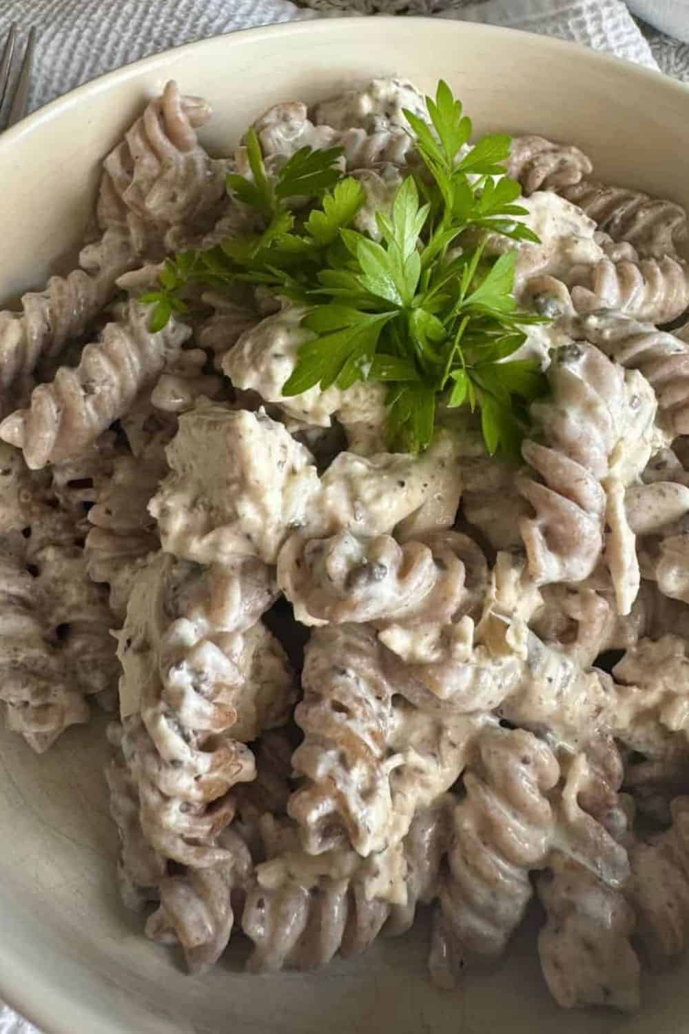 Creamy fusilli pasta topped with fresh parsley, perfect for comforting meals and great for pasta recipes.