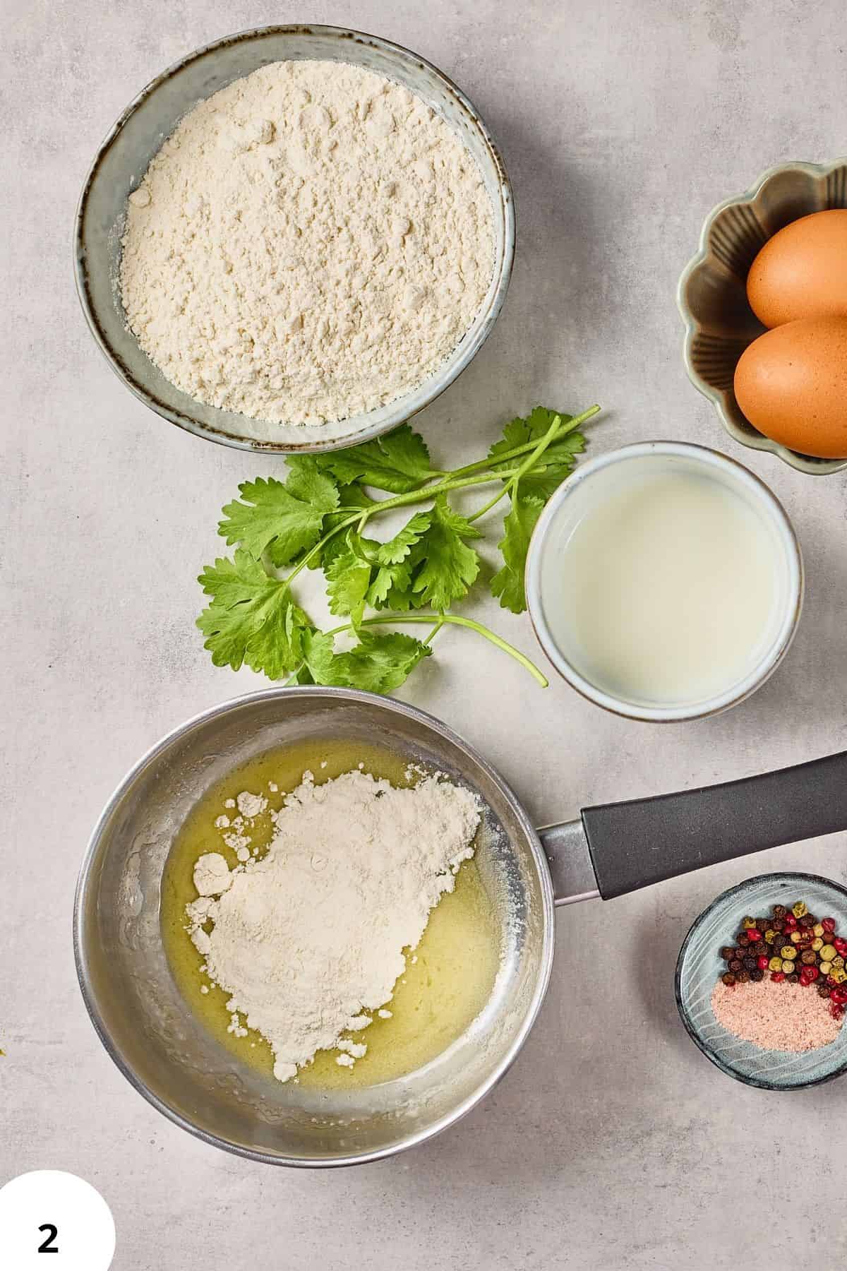 Delicious bread dough ingredients with flour, eggs, milk, and herbs ready for stretch and fold method.