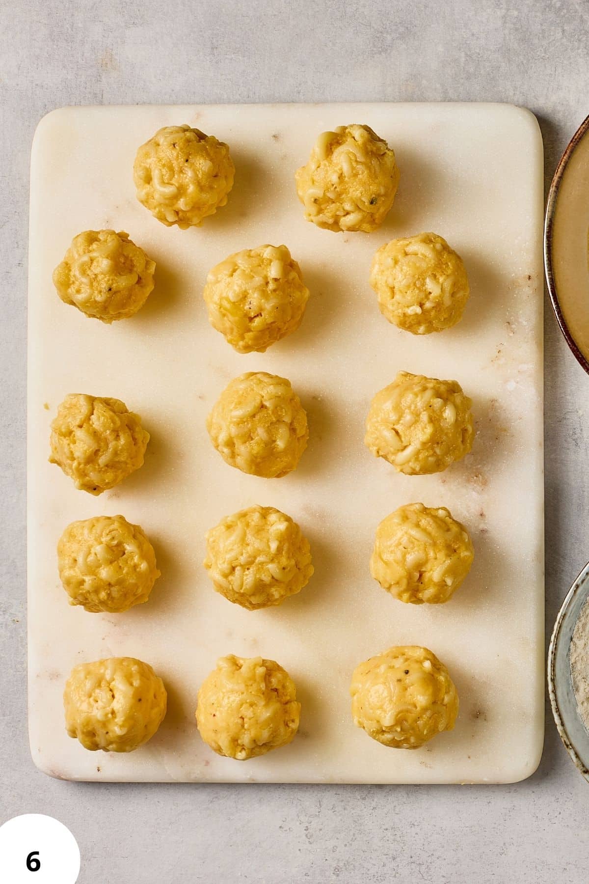 Freshly prepared bread dough balls ready for proofing and baking. Focus on kneading, shaping, and dough consistency.