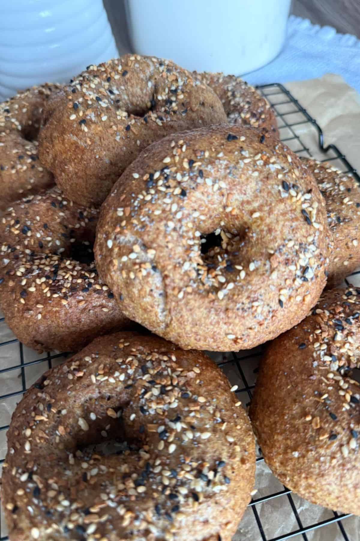 Delicious homemade bagels topped with sesame and poppy seeds, crafted with fresh milled grains.