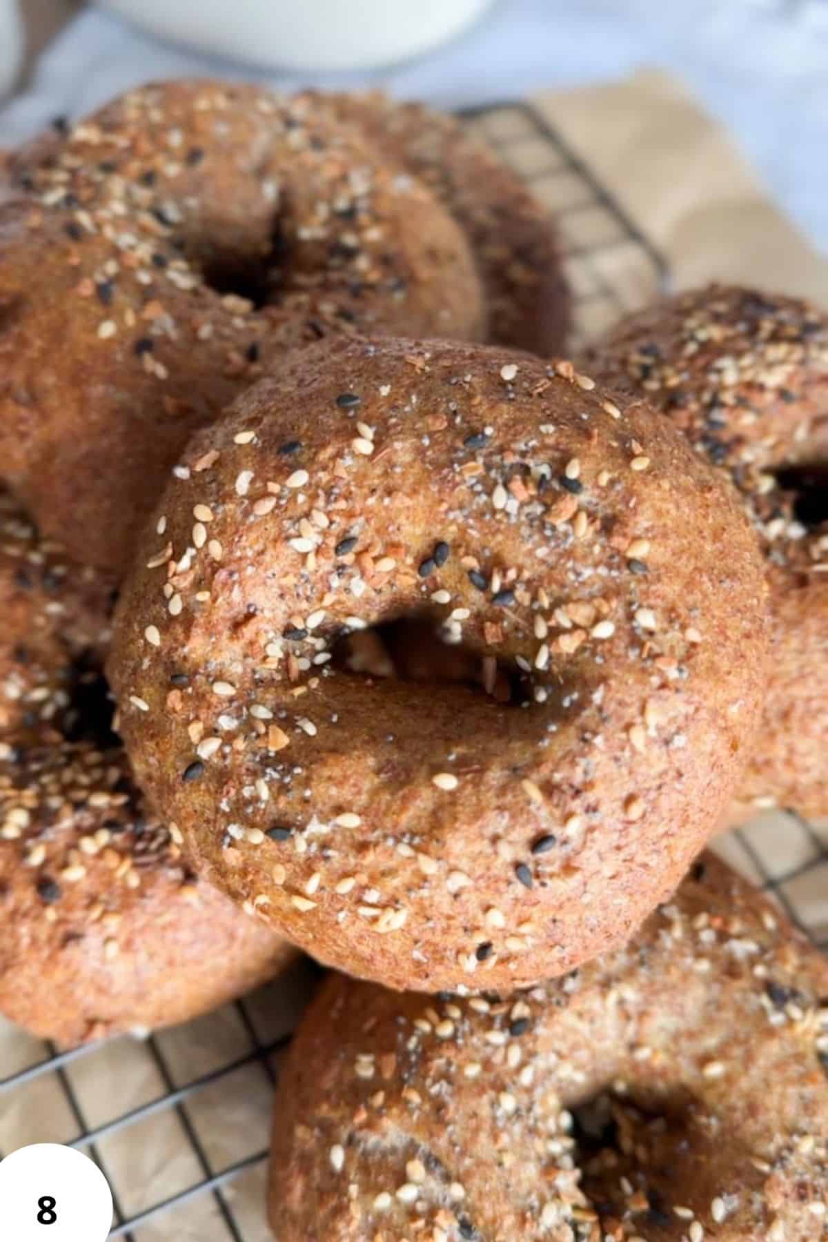 Delicious homemade bagels topped with seeds, perfect for breakfast or snacks.