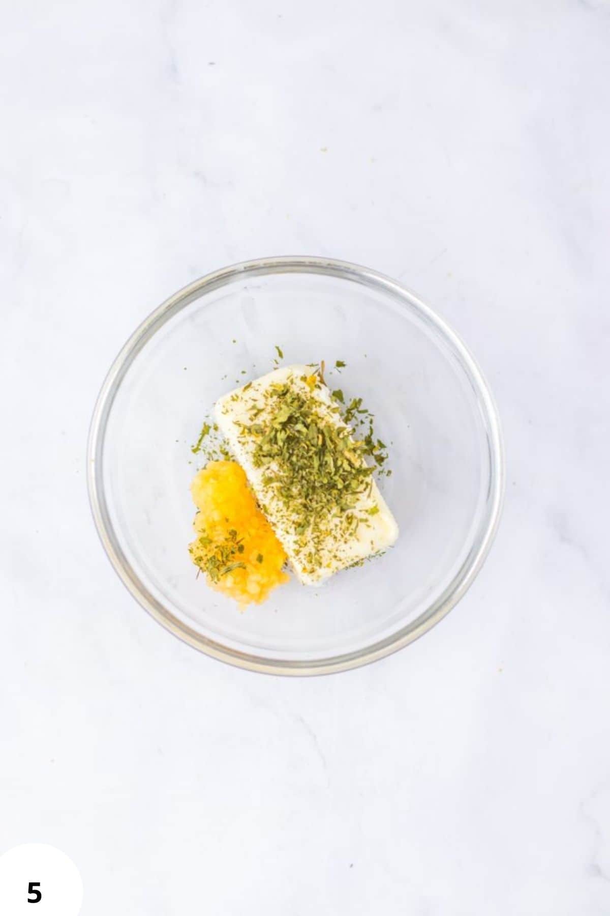 Butter, herbs, garlic, bread dough, baking ingredients, kneading, culinary essentials.