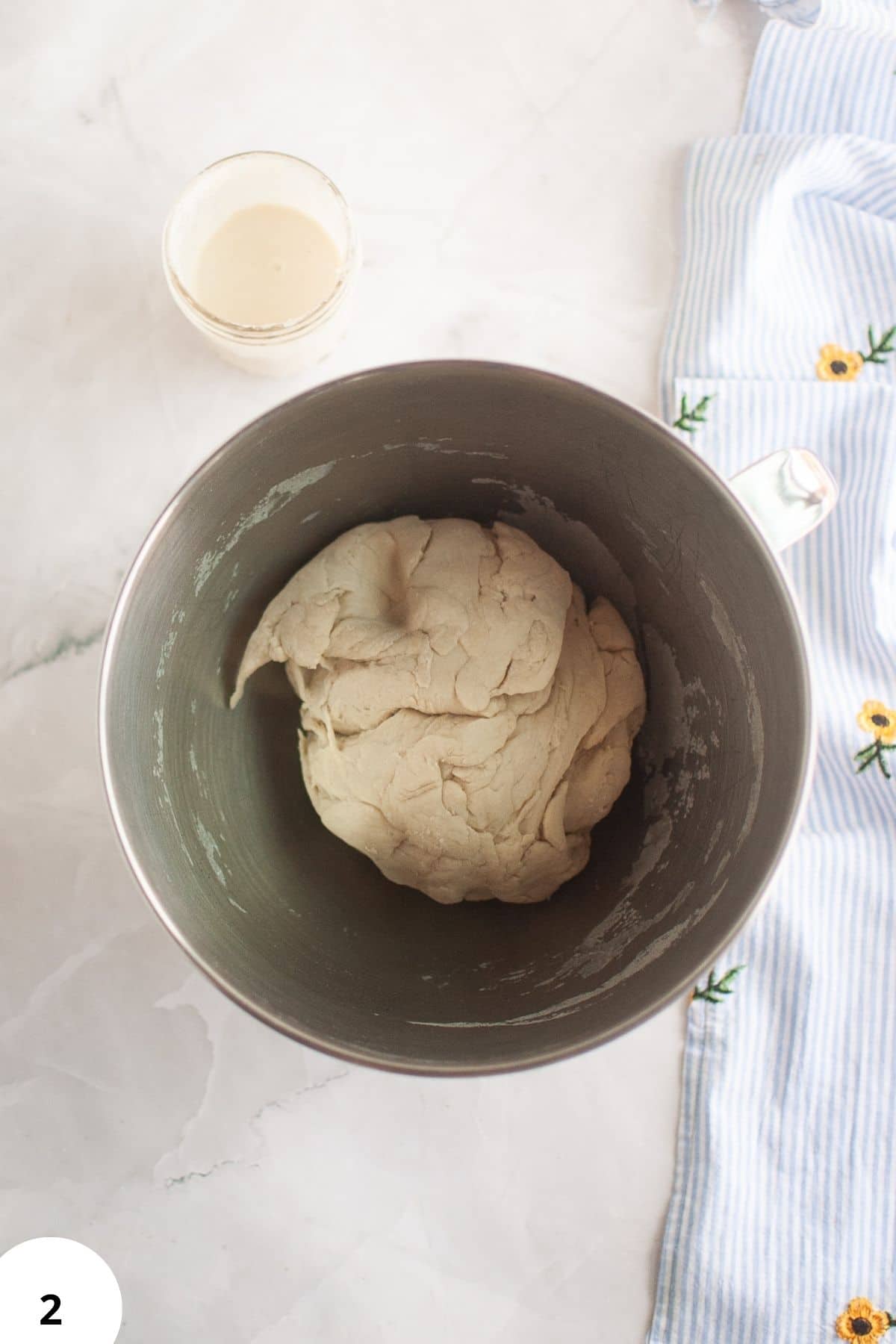 Dough in mixing bowl with ingredients, ready for stretch and folds.