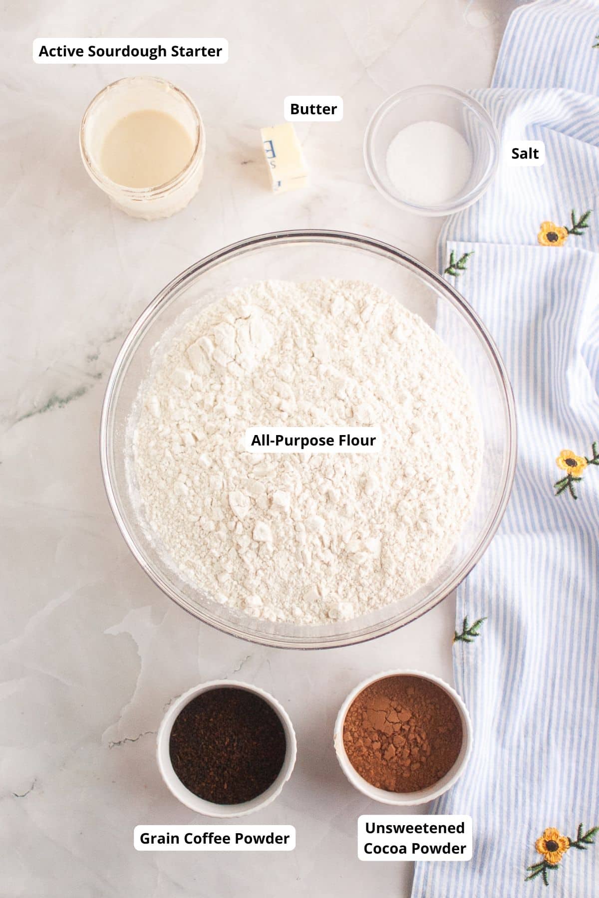 Bread dough being folded for gluten development in sourdough baking process.