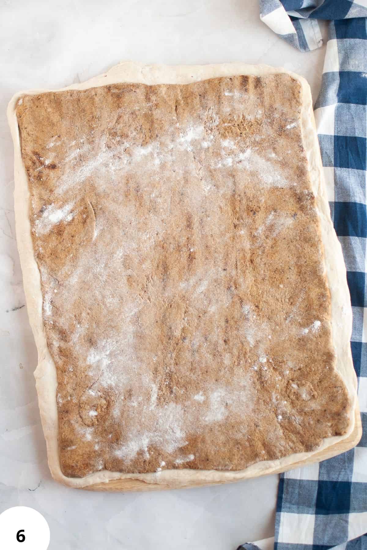 Dough ready for stretch and fold technique with visible flour, perfect for artisan bread making.
