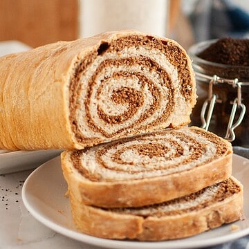 Delicious cinnamon roll pastry showcasing the art of stretch and fold technique for perfect bread baking.