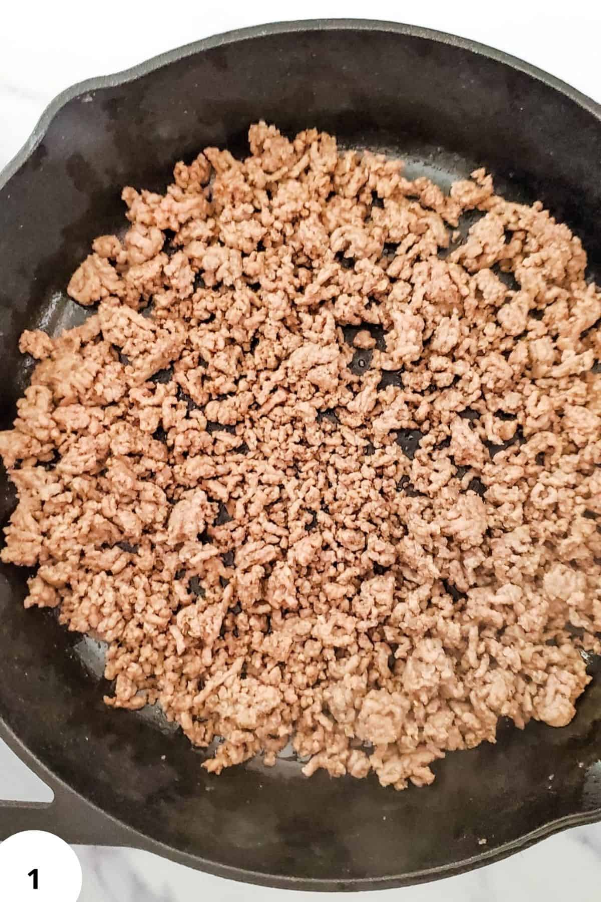Sautéed ground beef cooking in a pan, perfect for recipes like tacos or spaghetti.