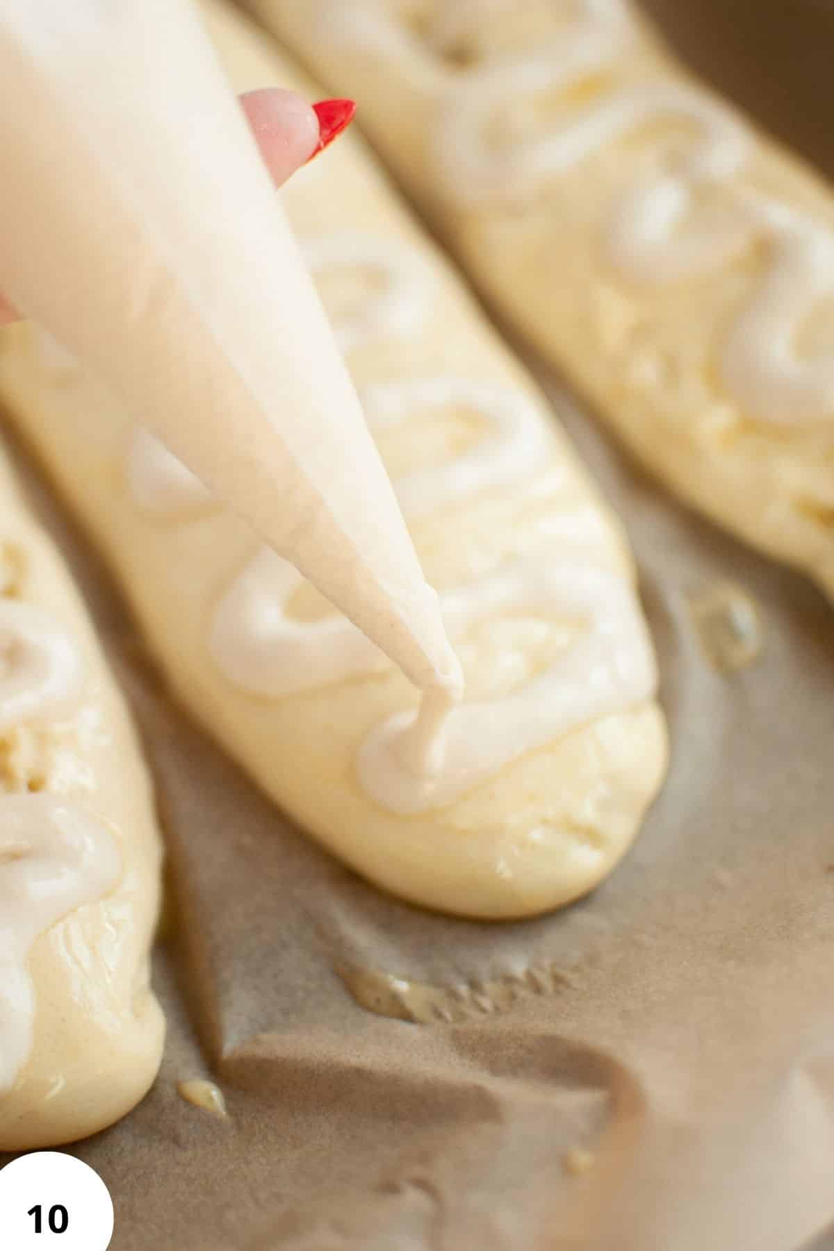 Delicate bread dough with smooth, creamy texture during shaping process.