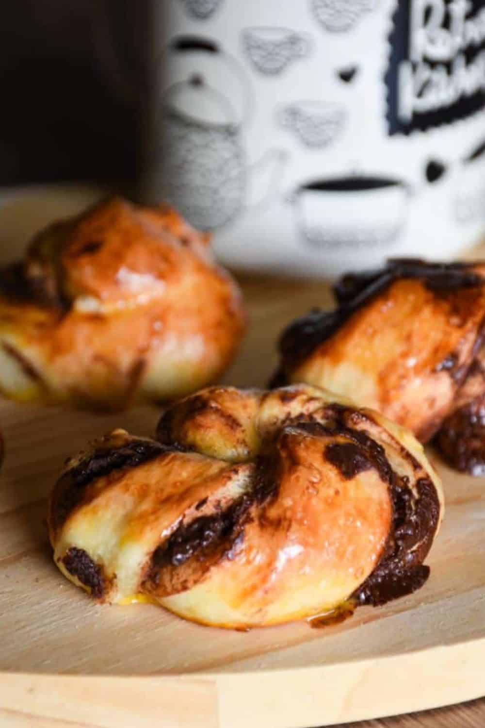 Delicious, freshly baked Danish pastries topped with rich chocolate, perfect for breakfast or snacks.