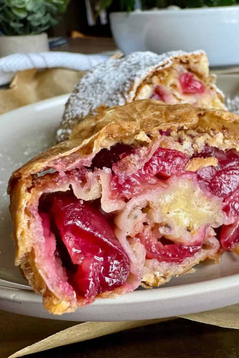 Delicious cherry pie showing layers of tart cherries and flaky crust. Perfect for dessert or a sweet snack.