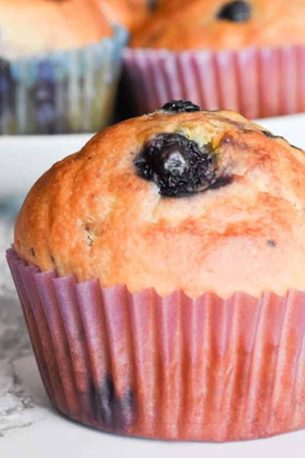 Delicious blueberry muffin with fresh blueberries, ideal for homemade baked goods and breakfast.
