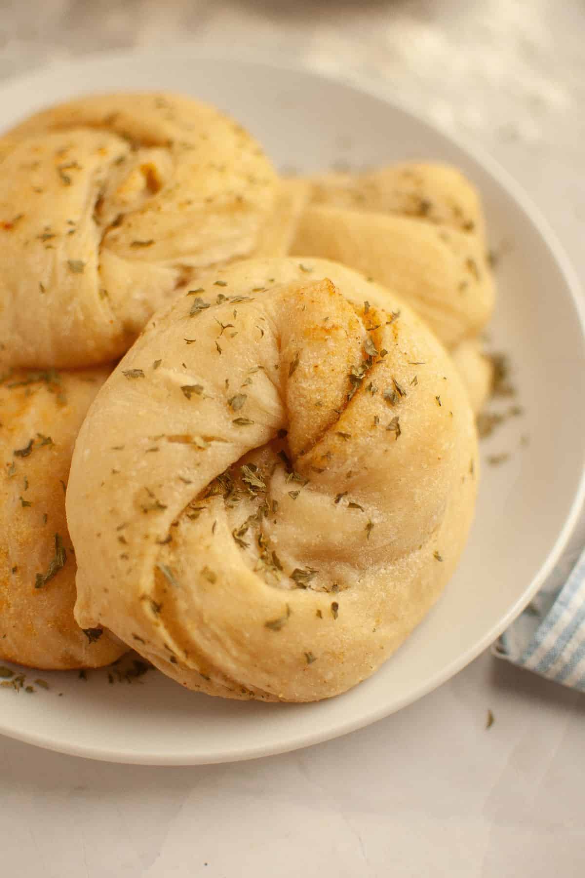 Freshly baked bread with herbs, highlighting stretch and fold techniques.