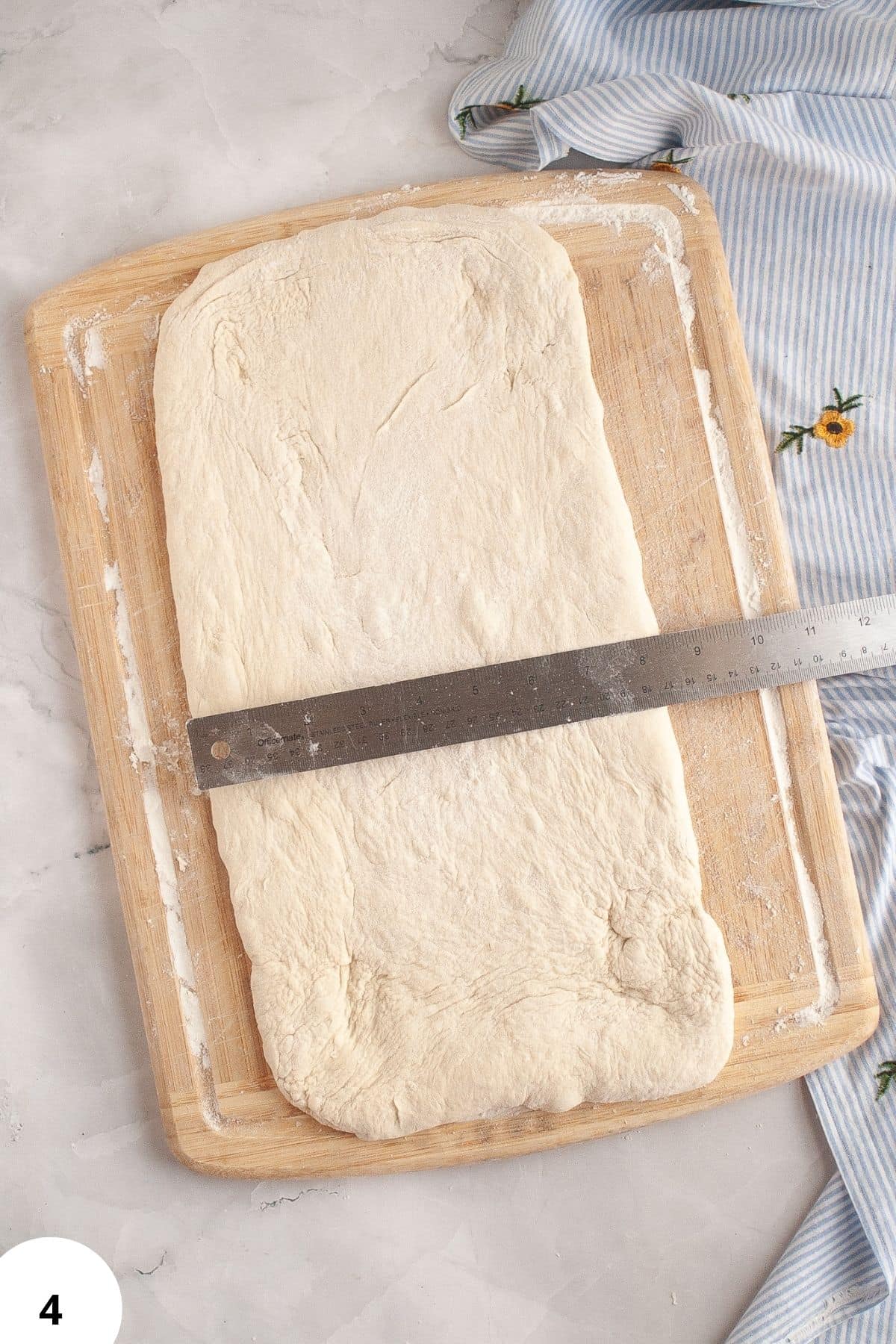 Machine for measuring dough size during stretching and folding techniques.