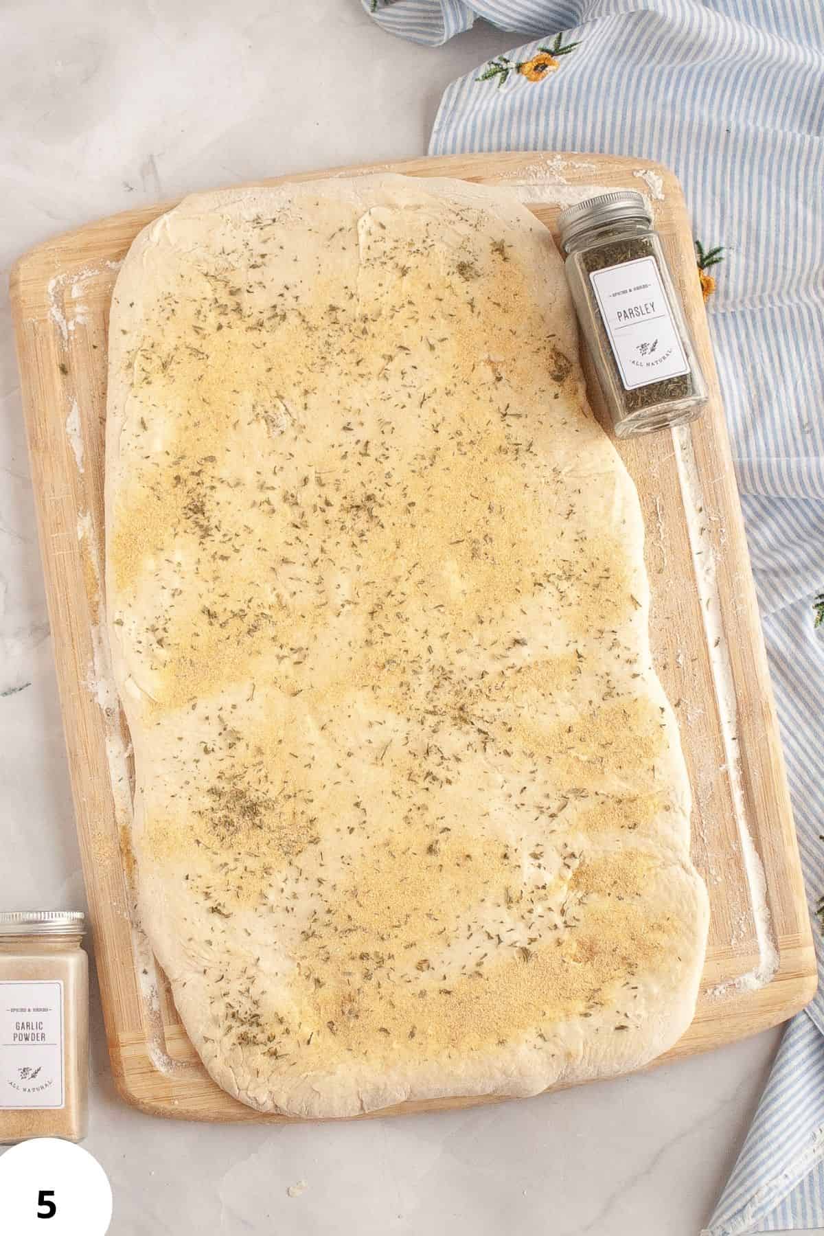 Herb herb bread dough with parsley, ready for folding and baking.
