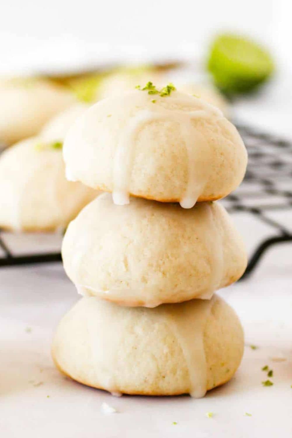 Delicious homemade cream cheese cookies with lime zest and glaze, perfect for baking enthusiasts.