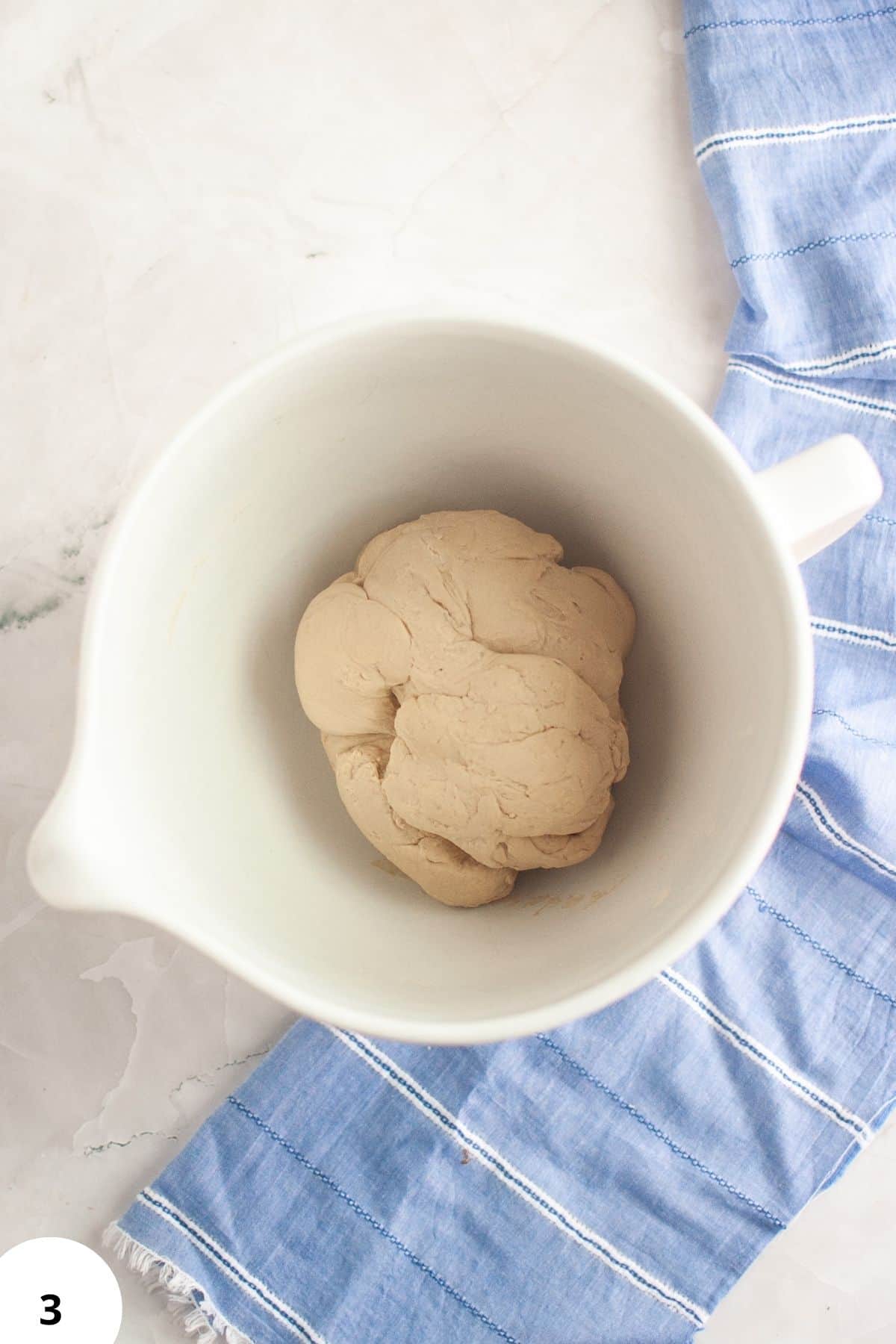 Dough prepared for stretching and folding to develop gluten structure. Ideal for artisan bread baking.