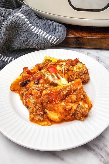 Delicious homemade meatloaf with tomato sauce on a white plate.