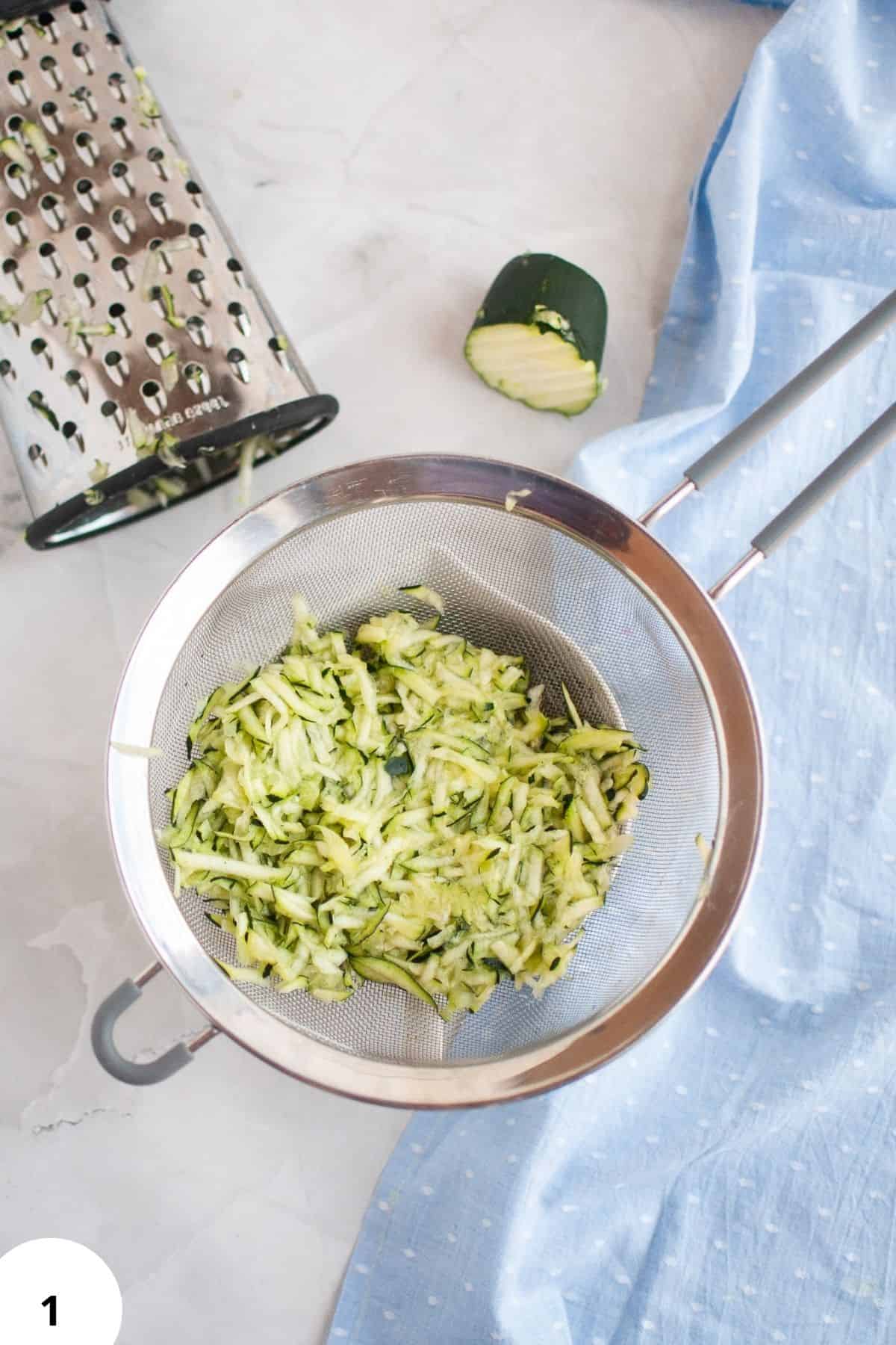 Sourdough stretch and folds process with shredded zucchini in a bowl.