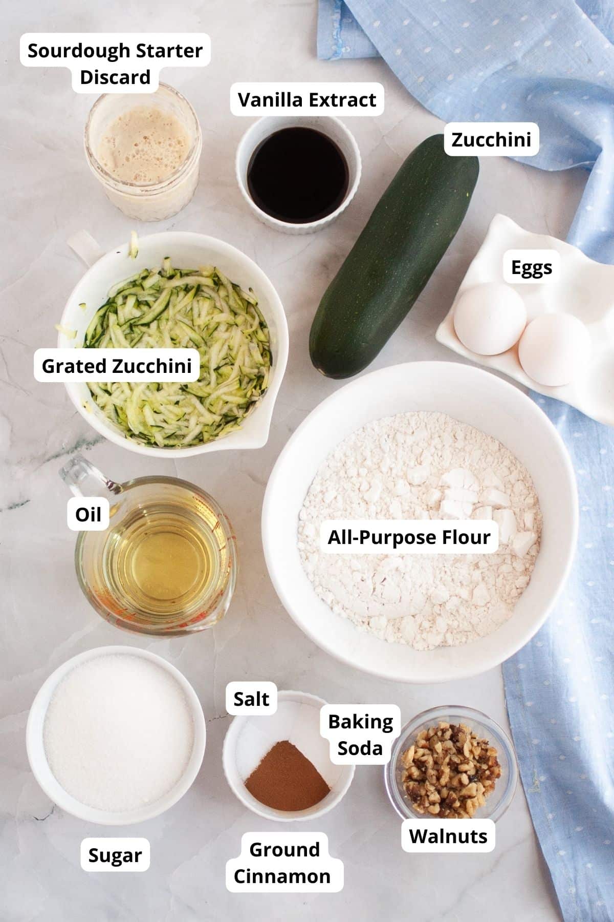 Ingredients for sourdough discard zucchini bread with walnuts and zucchini.