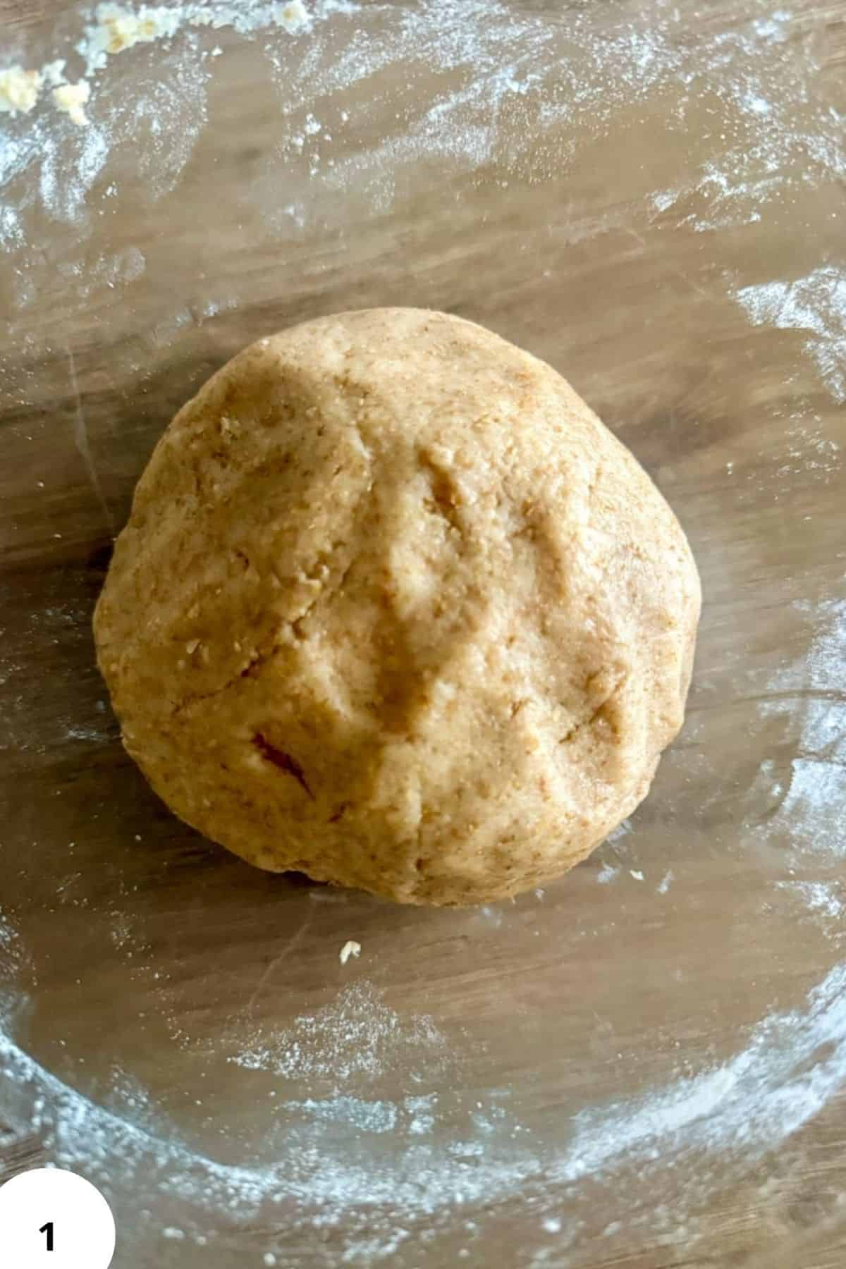 Raw dough for cinnamon toast crunch cereal on floured surface.