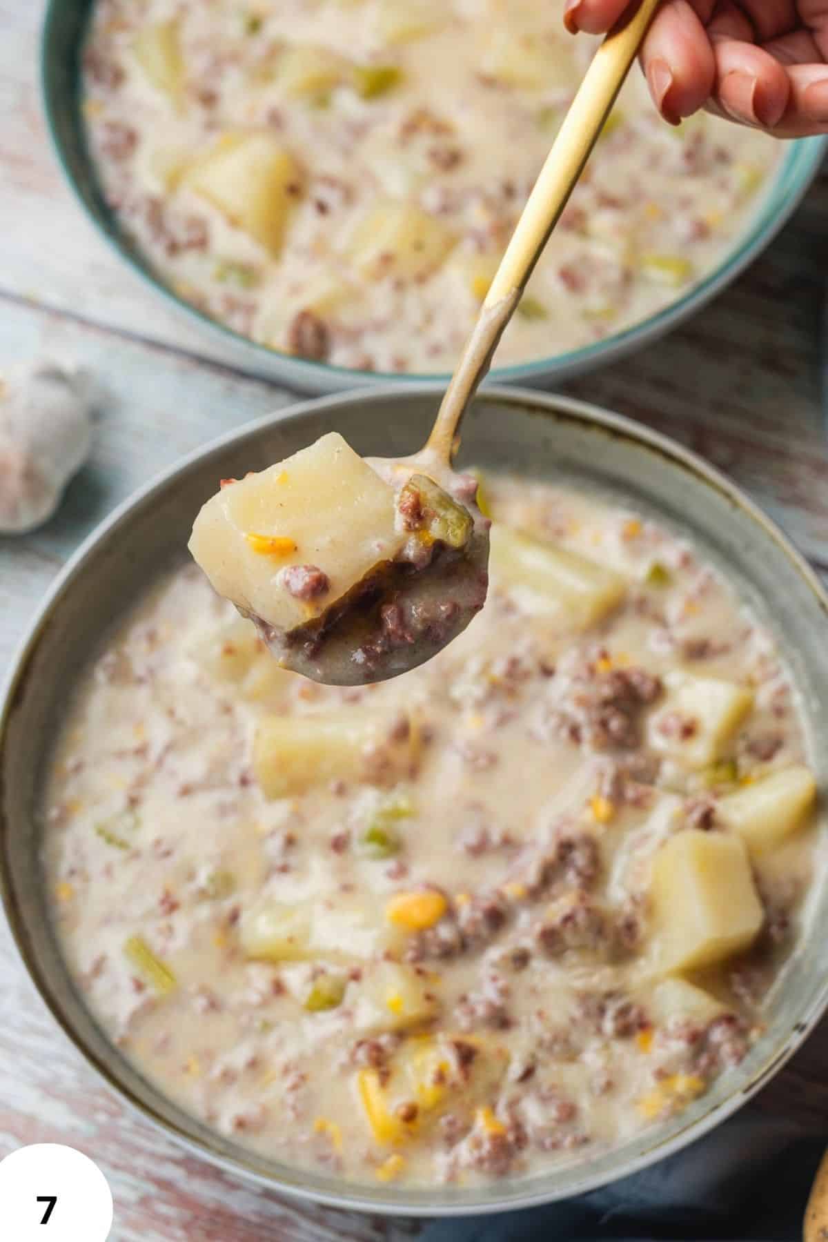 Hamburger and potato soup with a creamy broth and hearty ingredients. Perfect comfort food for cold.