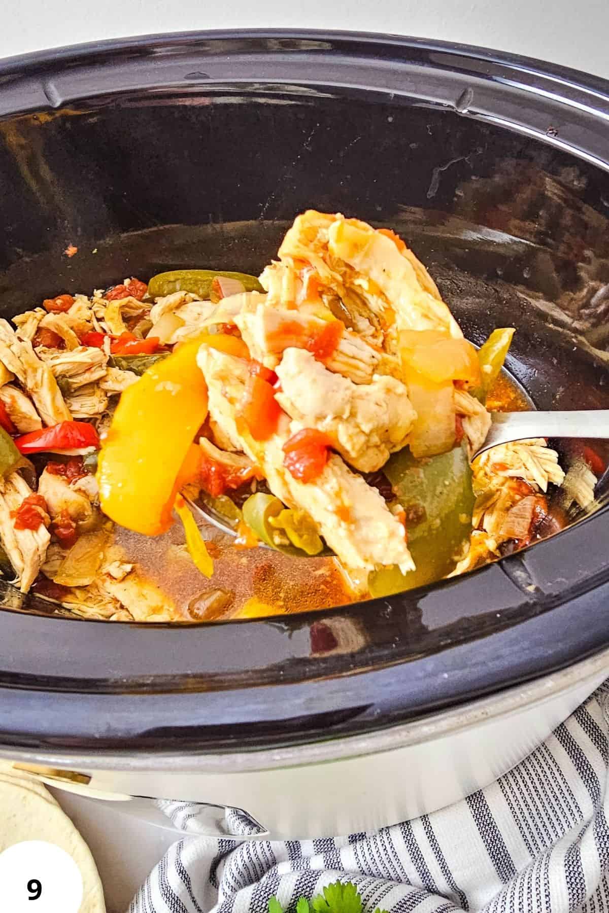 Delicious slow cooker chicken fajitas with peppers and onions in a savory sauce.