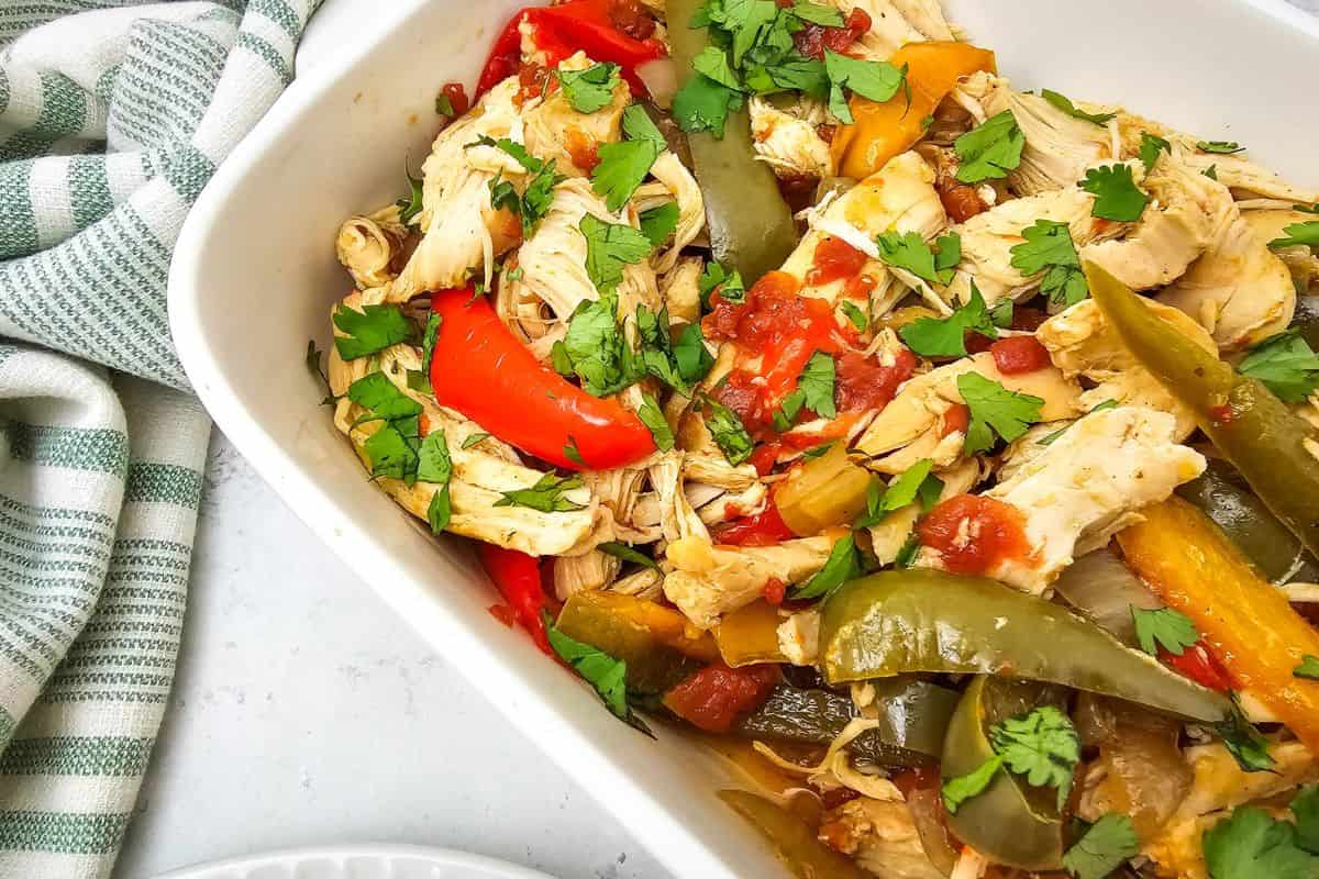 Healthy chicken fajitas with colorful peppers and fresh herbs.