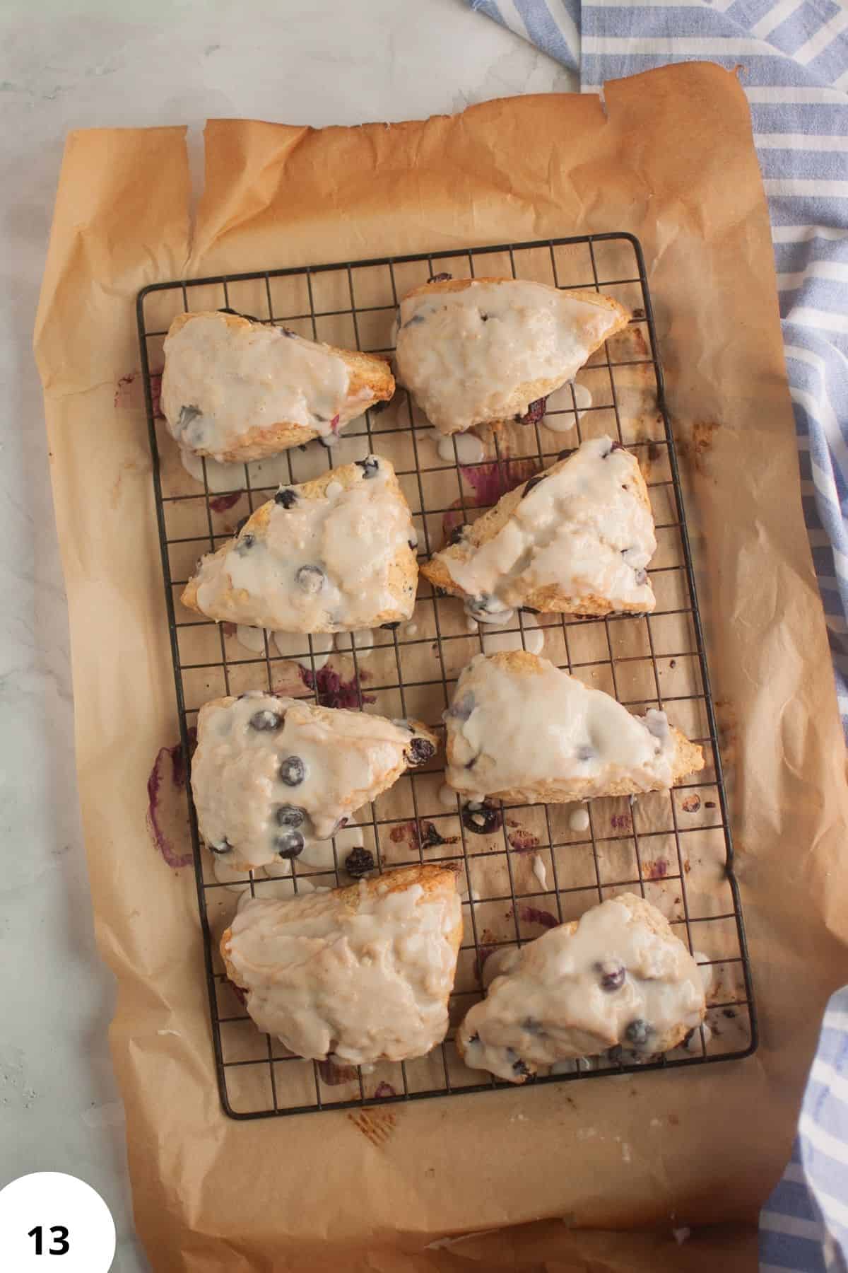 Sourdough blueberry cream scones cooling on a wire rack.